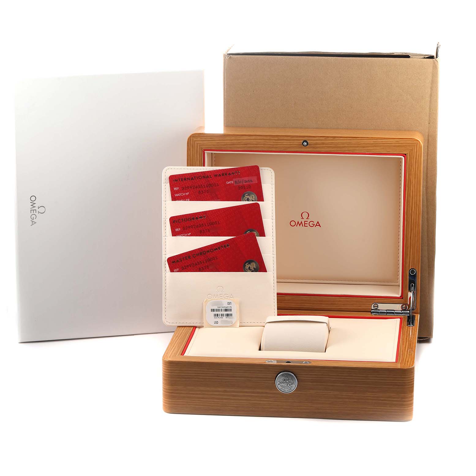 The image shows the Omega Speedmaster 329.92.43.51.10.001 Men's Rose Gold Brown Dial's box open, displaying red cards and an interior pillow for the watch.