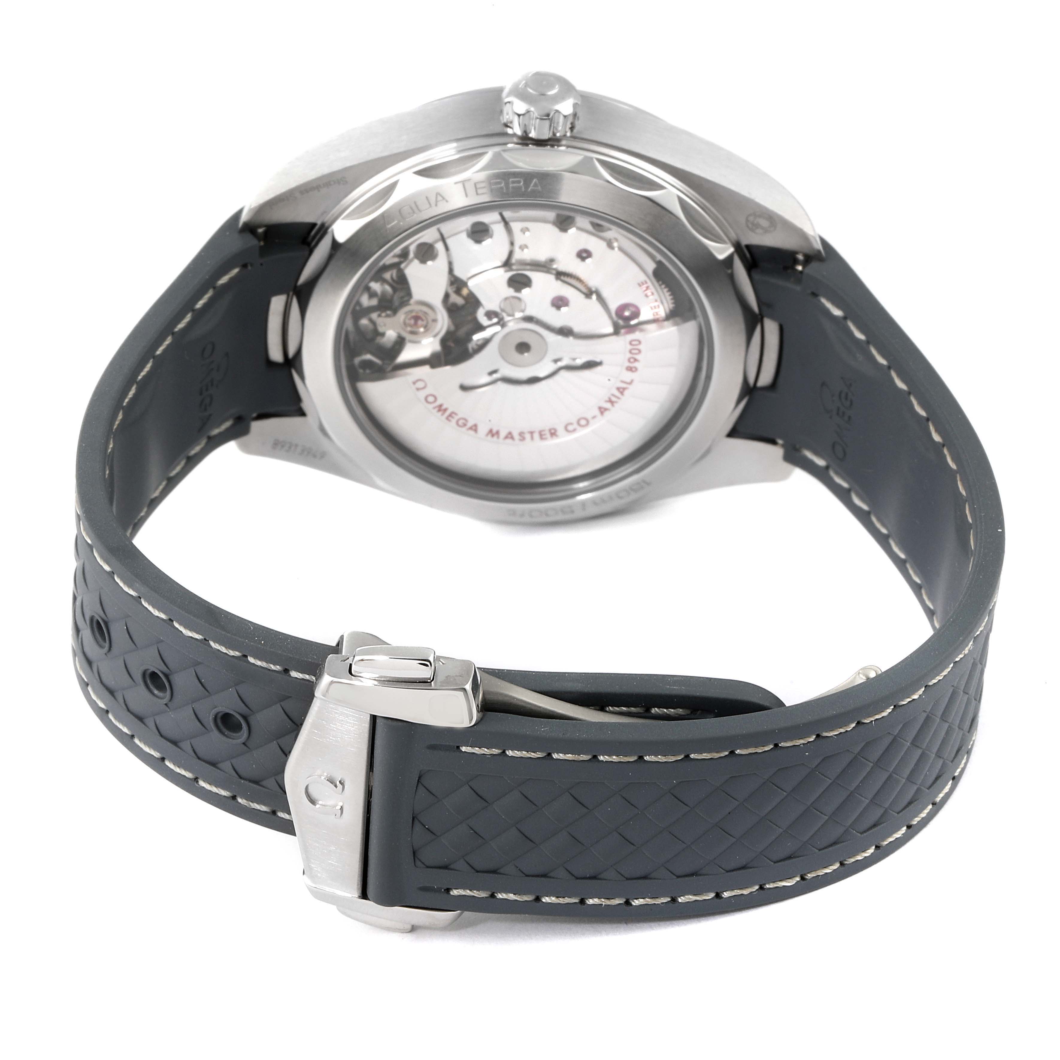 The image shows the back view of an Omega Aqua Terra 220.12.41.21.03.002 Men's Stainless Steel Blue Dial 220.12.41.21.03.002 Men's Stainless Steel Blue Dial watch, highlighting its movement and rubber strap.