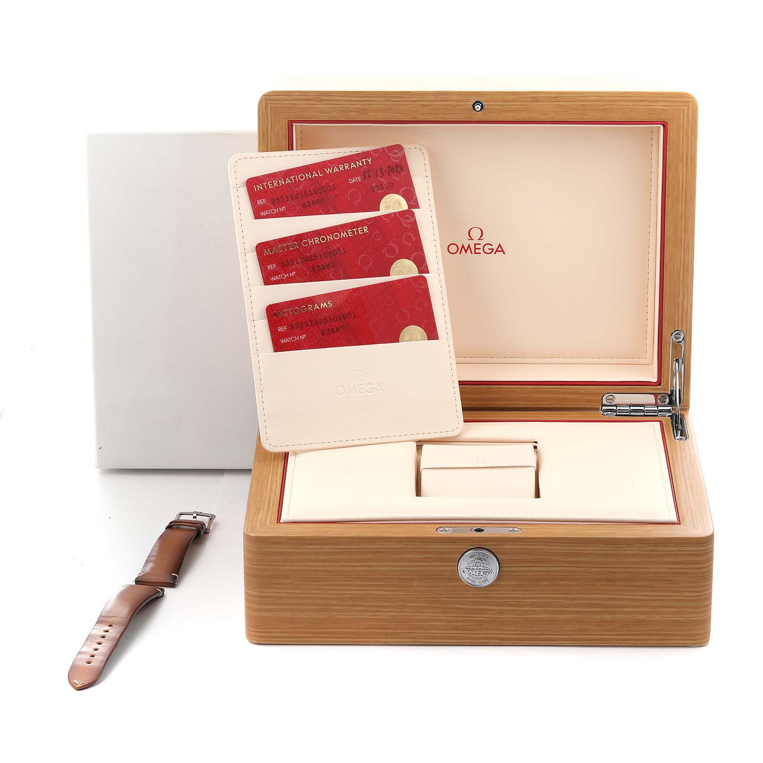 The image shows an Omega Speedmaster 332.12.41.51.01.001 Men
s Stainless Steel Black Dial 332.12.41.51.01.001 Men
s Stainless Steel Black Dial watch box with warranty cards and a separate leather strap.