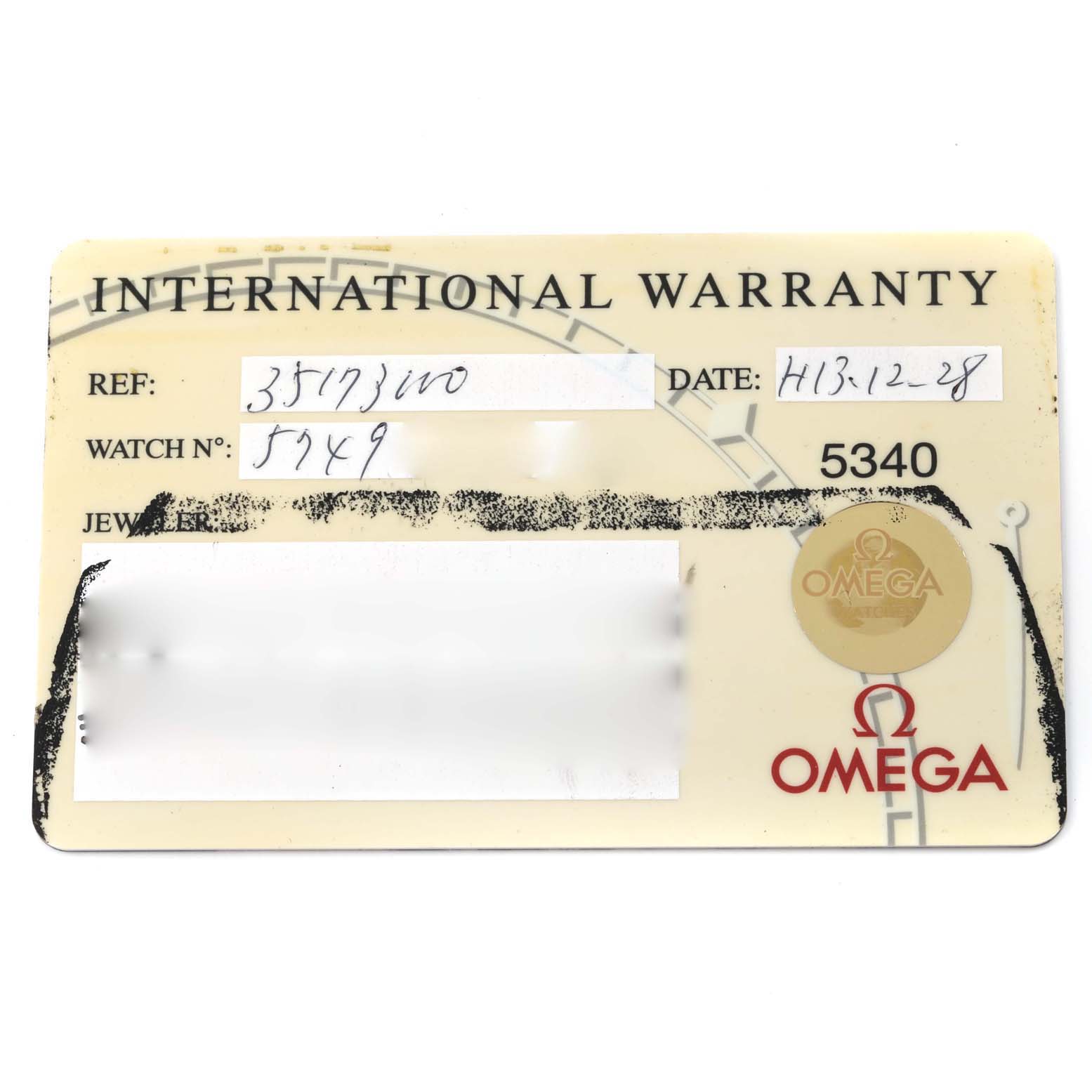 This image shows an Omega Speedmaster 3517.30.00 Men's Stainless Steel Silver Dial 3517.30.00 Men's Stainless Steel Silver Dial International Warranty card with details like reference number, watch number, and date.