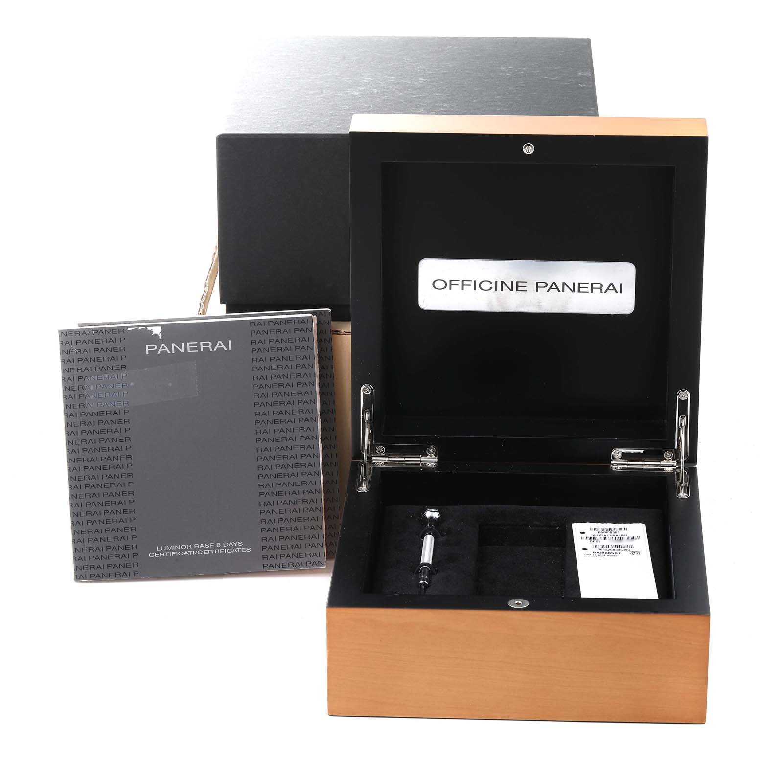 The image shows the packaging, manuals, and accessories for the Panerai Luminor PAM00561 Men
s Stainless Steel White Dial PAM00561 Men
s Stainless Steel White Dial watch, including the box and a screwdriver.