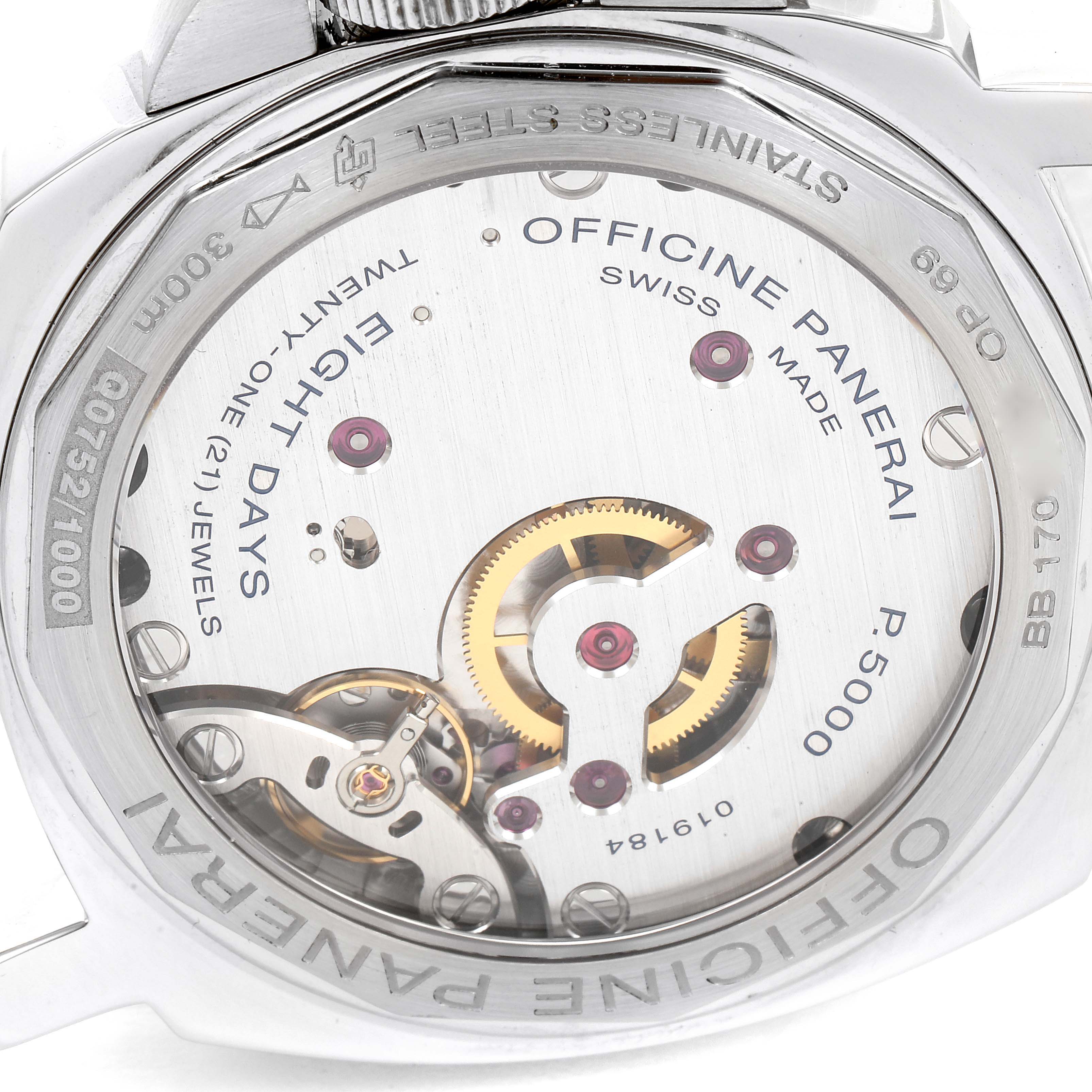 The image shows the back view of a Panerai Luminor PAM00561 Men
s Stainless Steel White Dial PAM00561 Men
s Stainless Steel White Dial watch, highlighting its internal mechanical components and inscriptions.