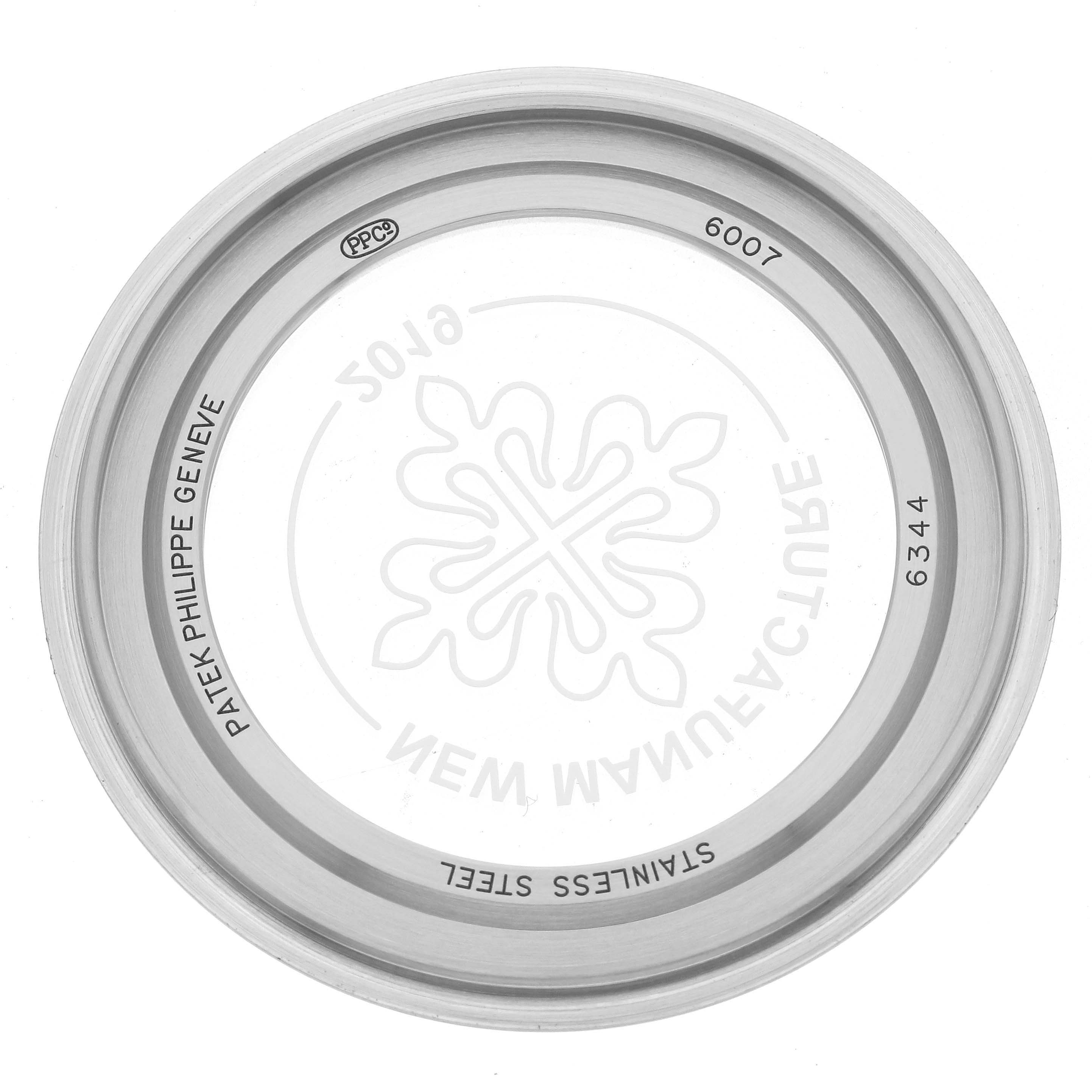 The image shows a top-down view of a Patek Philippe Calatrava 6007A-001 Men's Stainless Steel Blue Dial 6007A-001 Men's Stainless Steel Blue Dial watch's stainless steel back case.