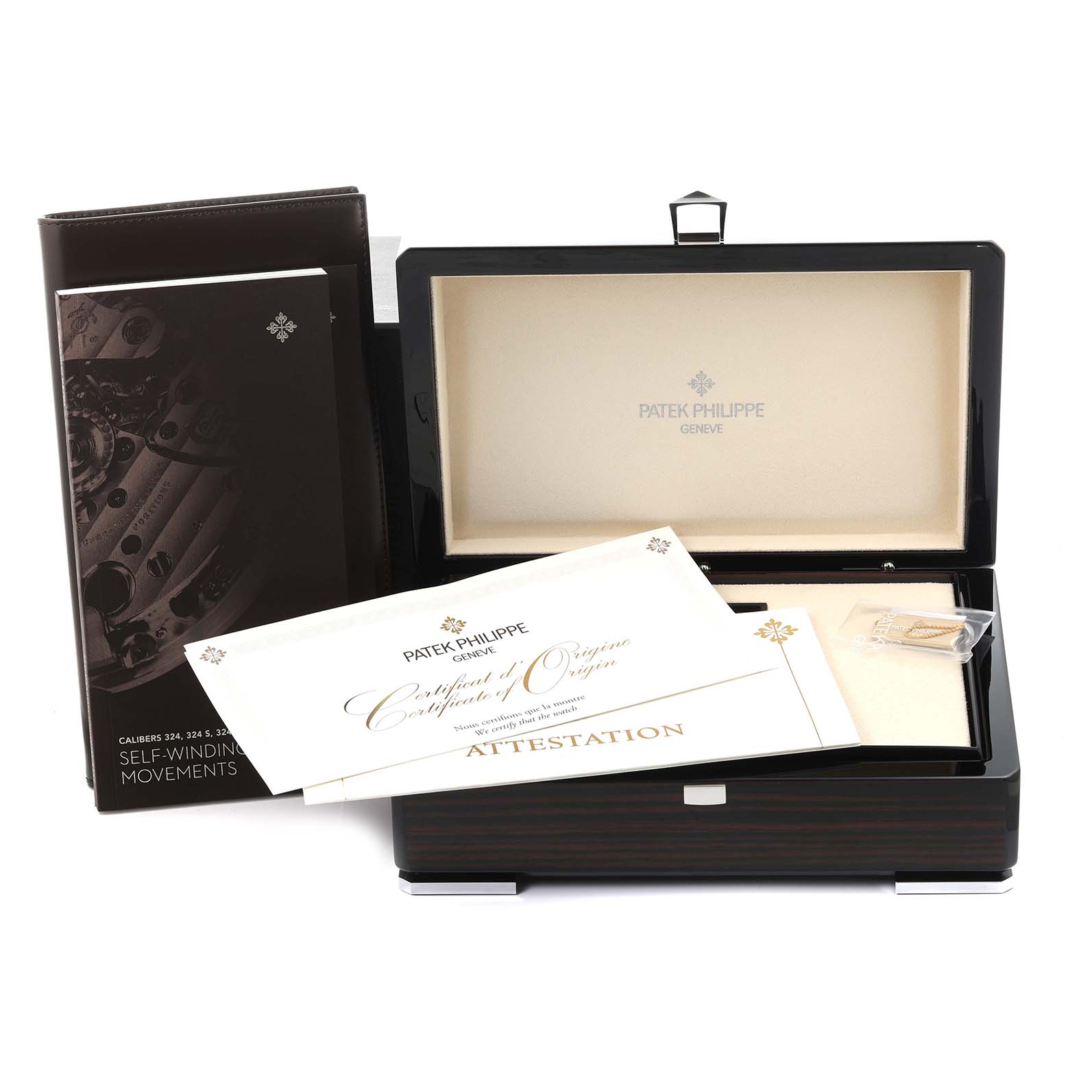 The image shows a Patek Philippe Calatrava 6007A-001 Men's Stainless Steel Blue Dial 6007A-001 Men's Stainless Steel Blue Dial box, a certificate, and a booklet, viewed from a front angle.