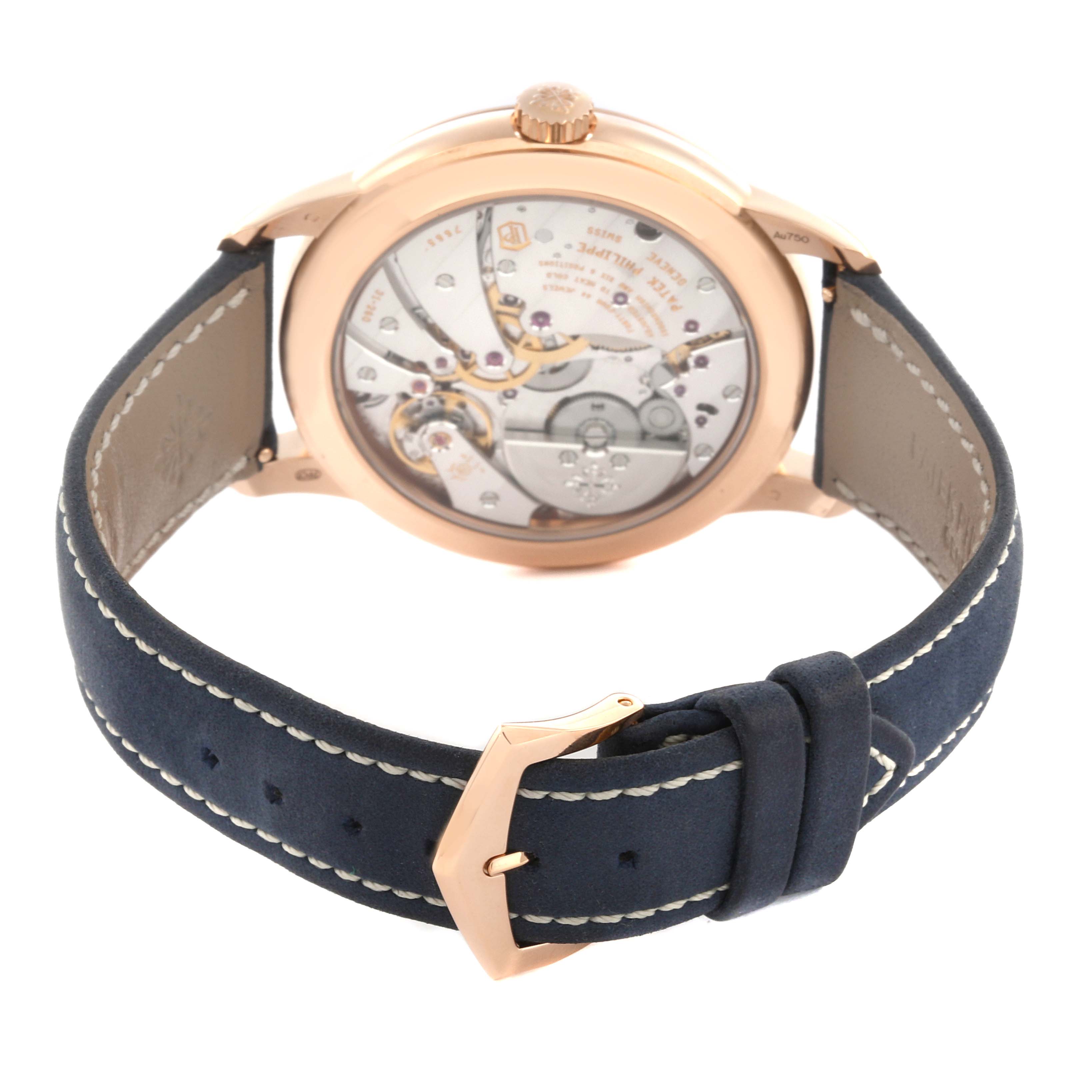 The image shows the back view of a Patek Philippe Calatrava 5224R-001 Men's Rose Gold Blue Dial 5224R-001 Men's Rose Gold Blue Dial watch, highlighting its movement and leather strap.