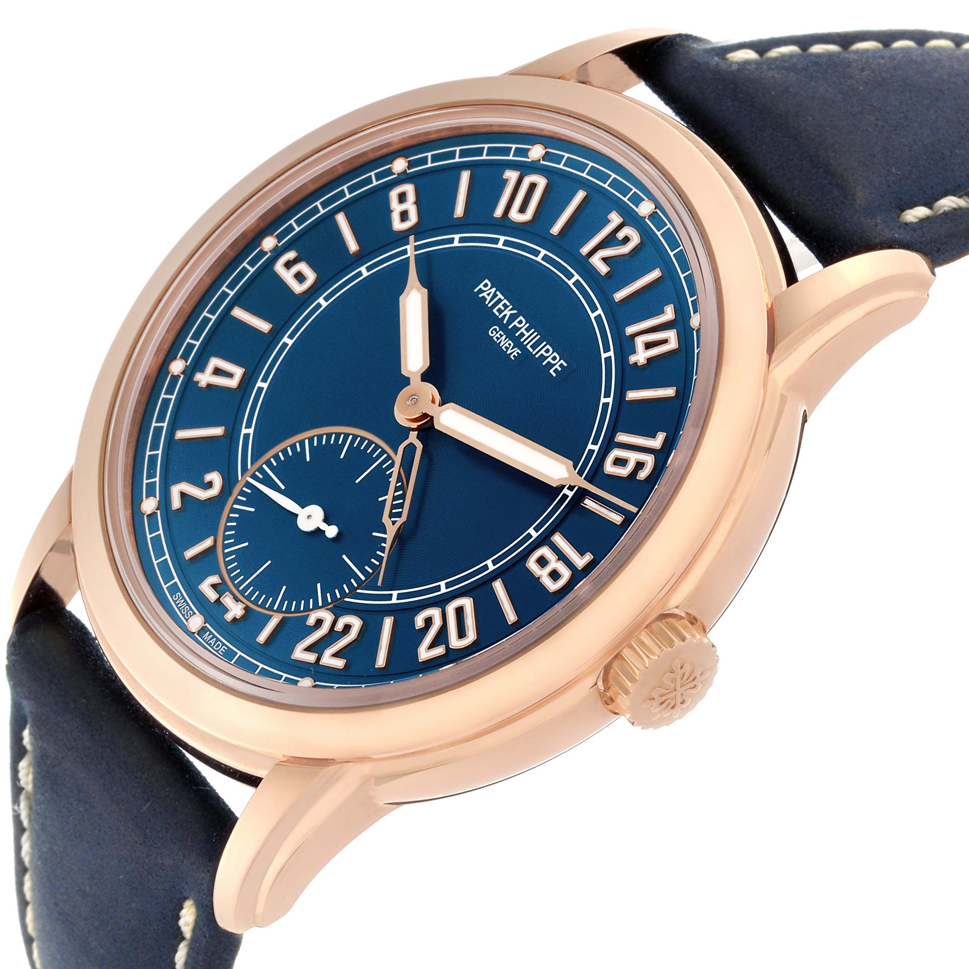 The Patek Philippe Calatrava 5224R-001 Men's Rose Gold Blue Dial 5224R-001 Men's Rose Gold Blue Dial watch is shown from a low angle, displaying the blue dial, gold case, hands, and strap stitching.