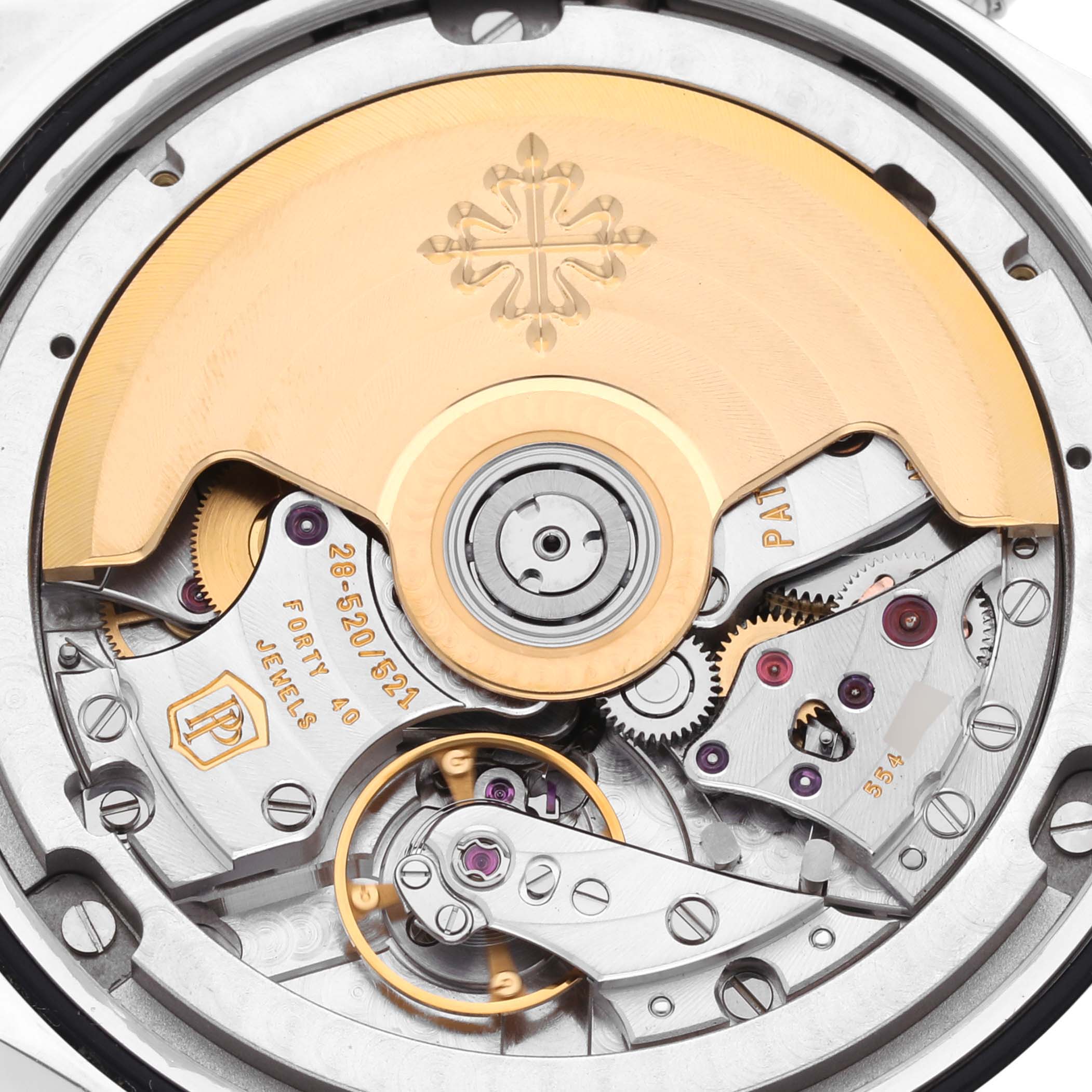 The image shows the movement of a Patek Philippe Complications 5960P-015 Men's Platinum Blue Dial 5960P-015 Men's Platinum Blue Dial watch from a back angle, highlighting its intricate mechanical parts.