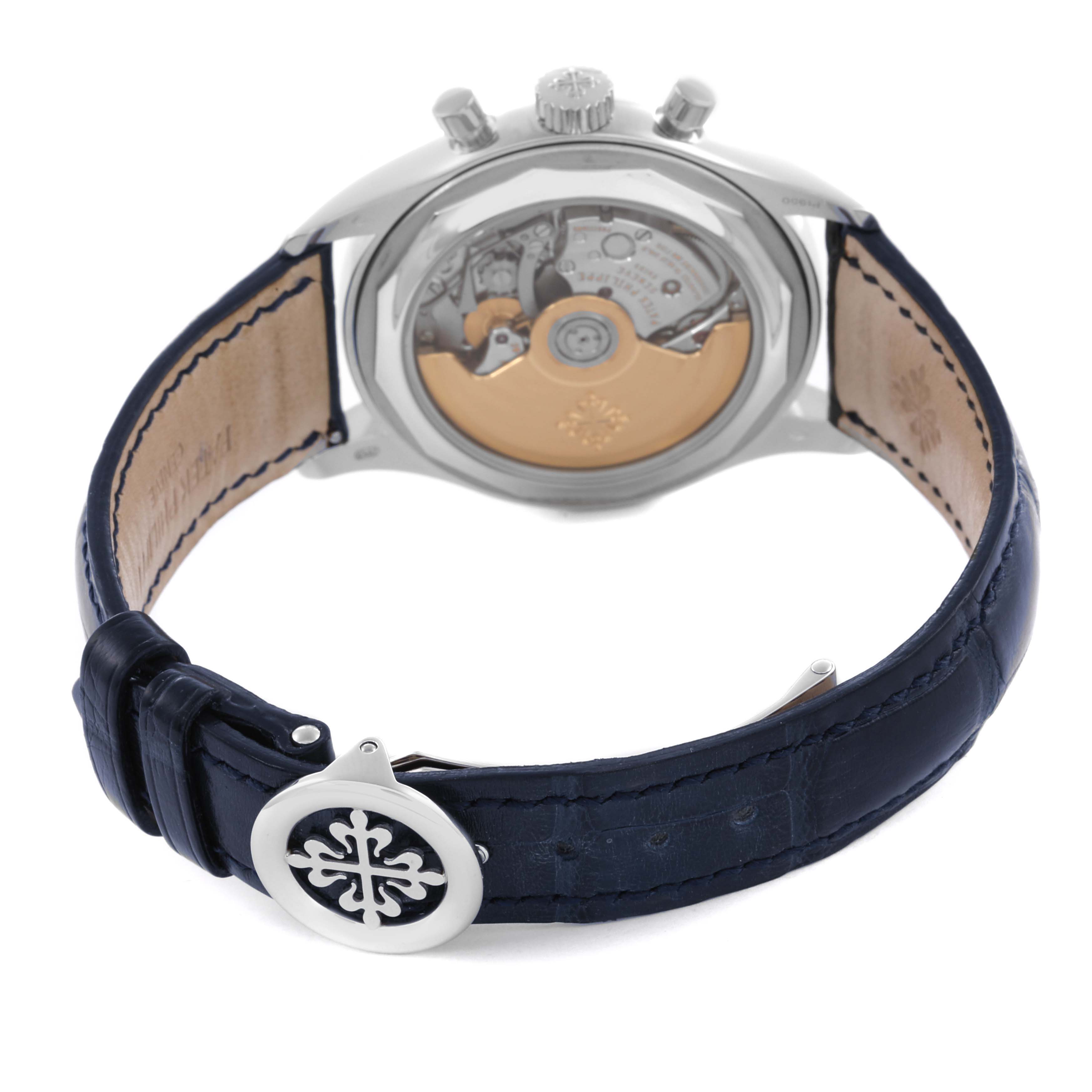 The image shows the back of the Patek Philippe Complications 5960P-015 Men's Platinum Blue Dial 5960P-015 Men's Platinum Blue Dial watch, highlighting the movement and leather strap clasp.