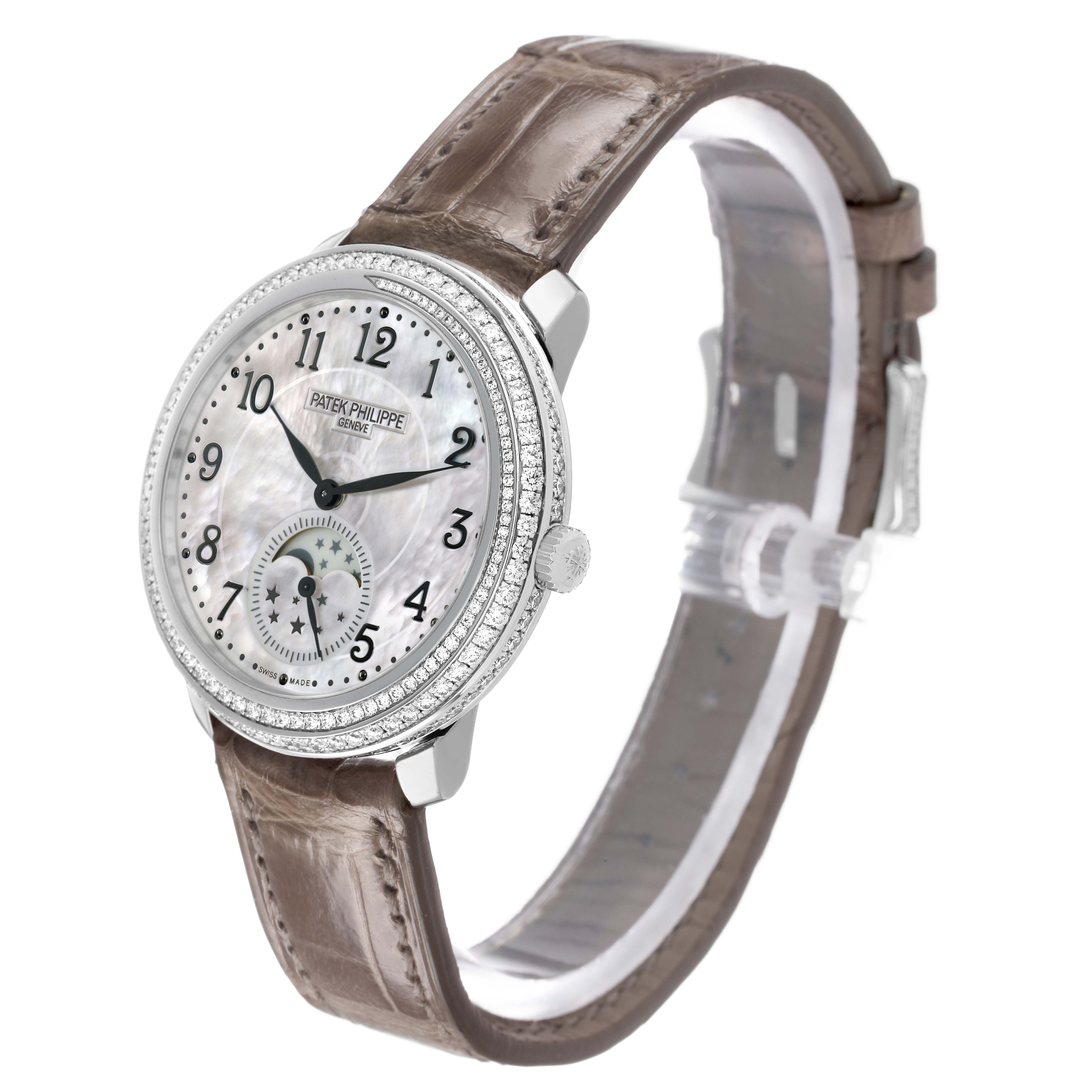The Patek Philippe Complications 4968G-010 Women's White Gold Mother of Pearl Dial watch is shown at a three-quarter angle, highlighting the face, bezel, and strap.