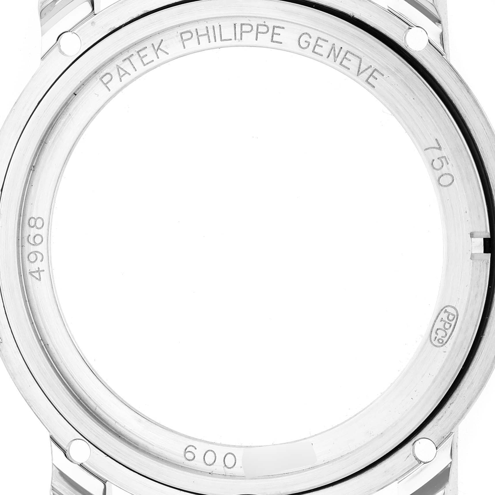 The image shows the back case of a Patek Philippe Complications 4968G-010 Women's White Gold Mother of Pearl Dial model, featuring engravings and a glimpse of the case structure.