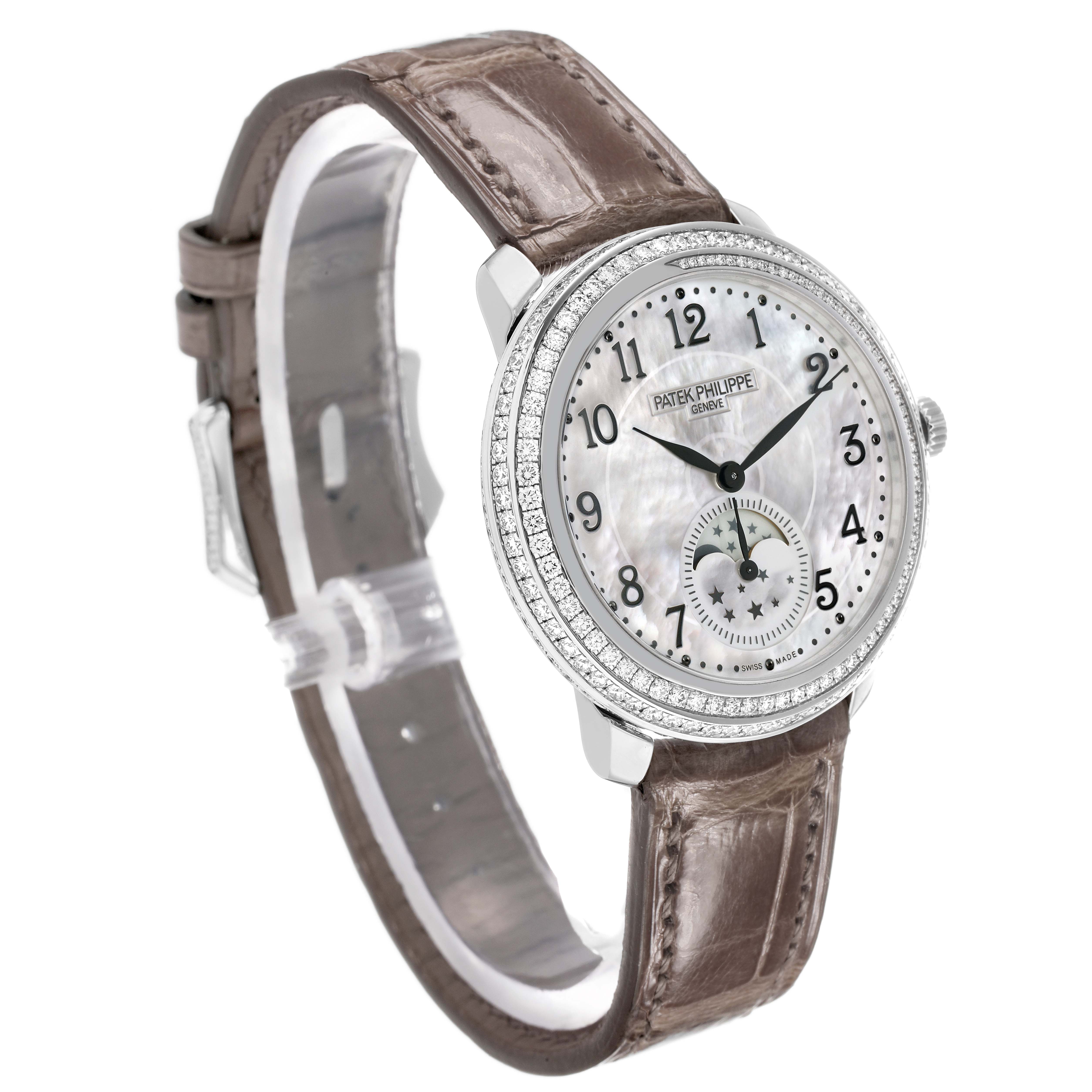 The Patek Philippe Complications 4968G-010 Women's White Gold Mother of Pearl Dial watch is shown at a slight angled view, highlighting the face, dial, and leather strap with a diamond-set bezel.