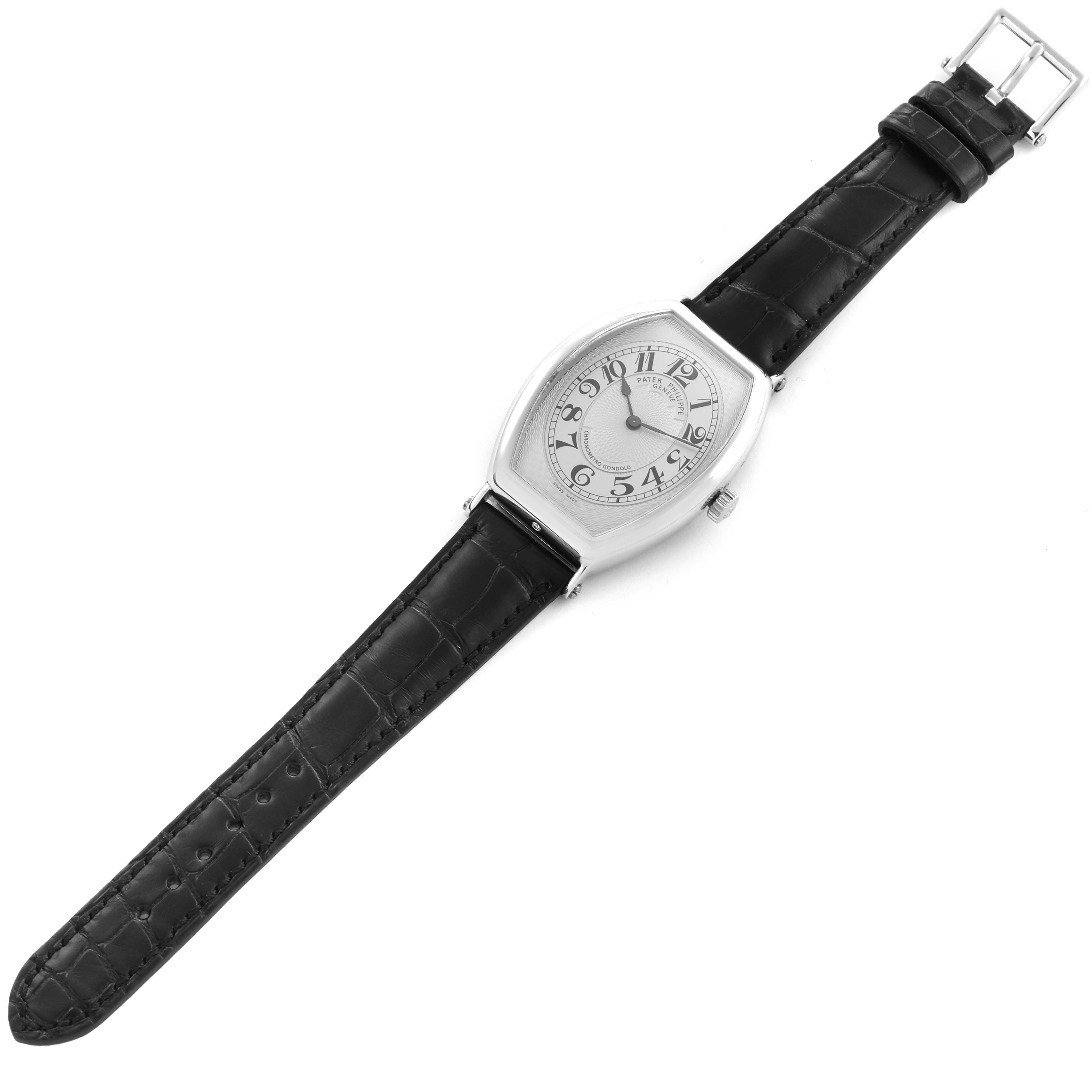 The Patek Philippe Gondolo 5098P-001 Men's Platinum Silver Dial 5098P-001 Men's Platinum Silver Dial watch is shown at an angle displaying the face, strap, case, and buckle.