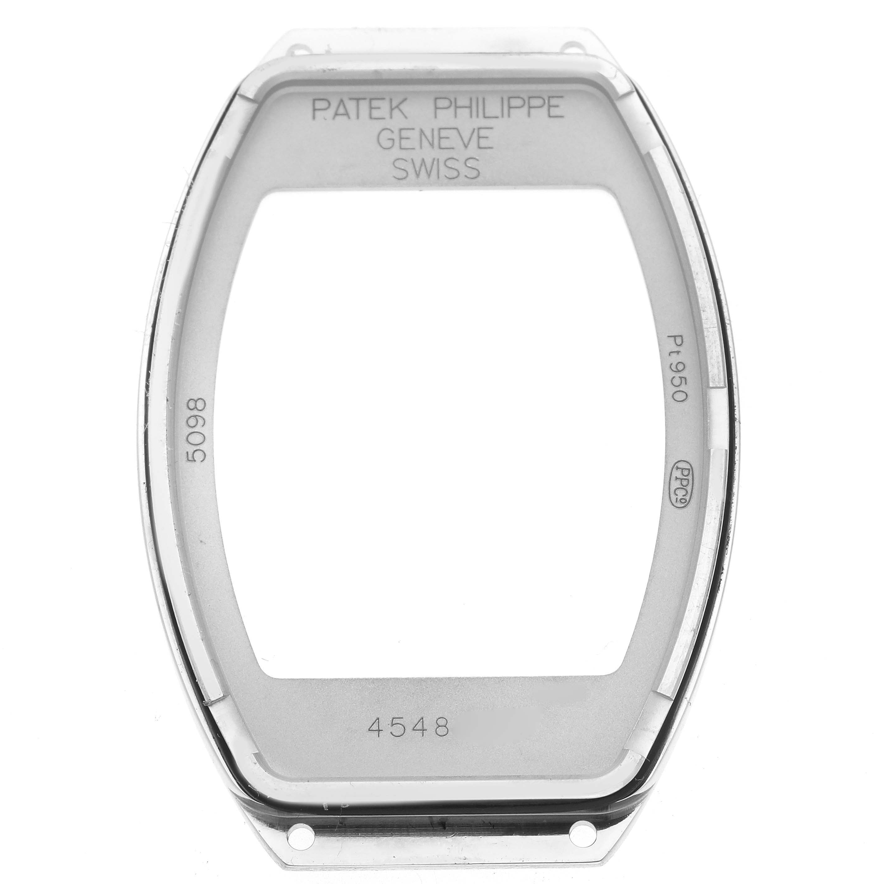 The image shows a Patek Philippe Gondolo 5098P-001 Men's Platinum Silver Dial 5098P-001 Men's Platinum Silver Dial watch case frame from a top view, displaying engraved details and openings for assembly.