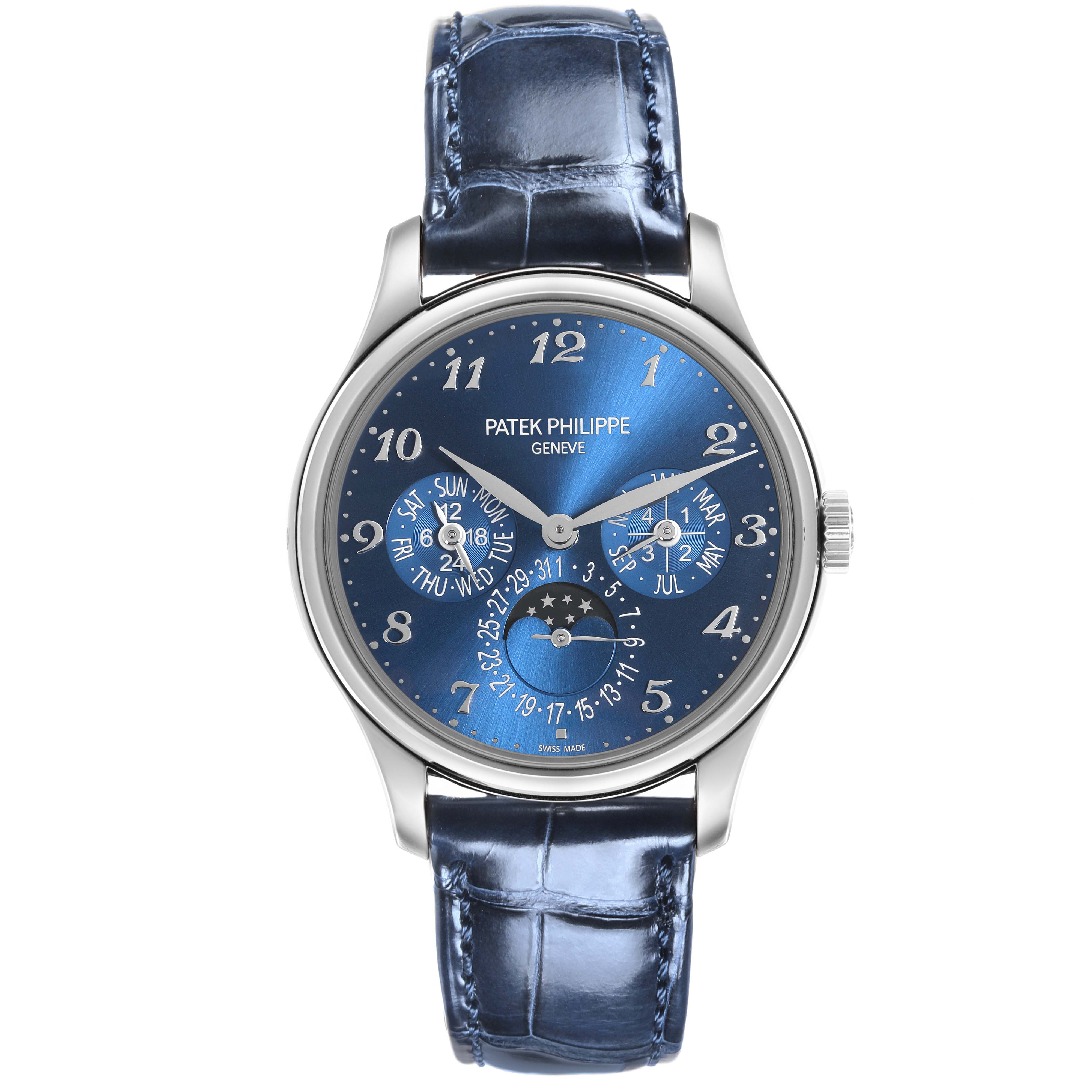 The image shows a front view of the Patek Philippe Complications 5327G-001 Men's White Gold Blue Dial 5327G-001 Men's White Gold Blue Dial model, highlighting its blue dial and leather strap.