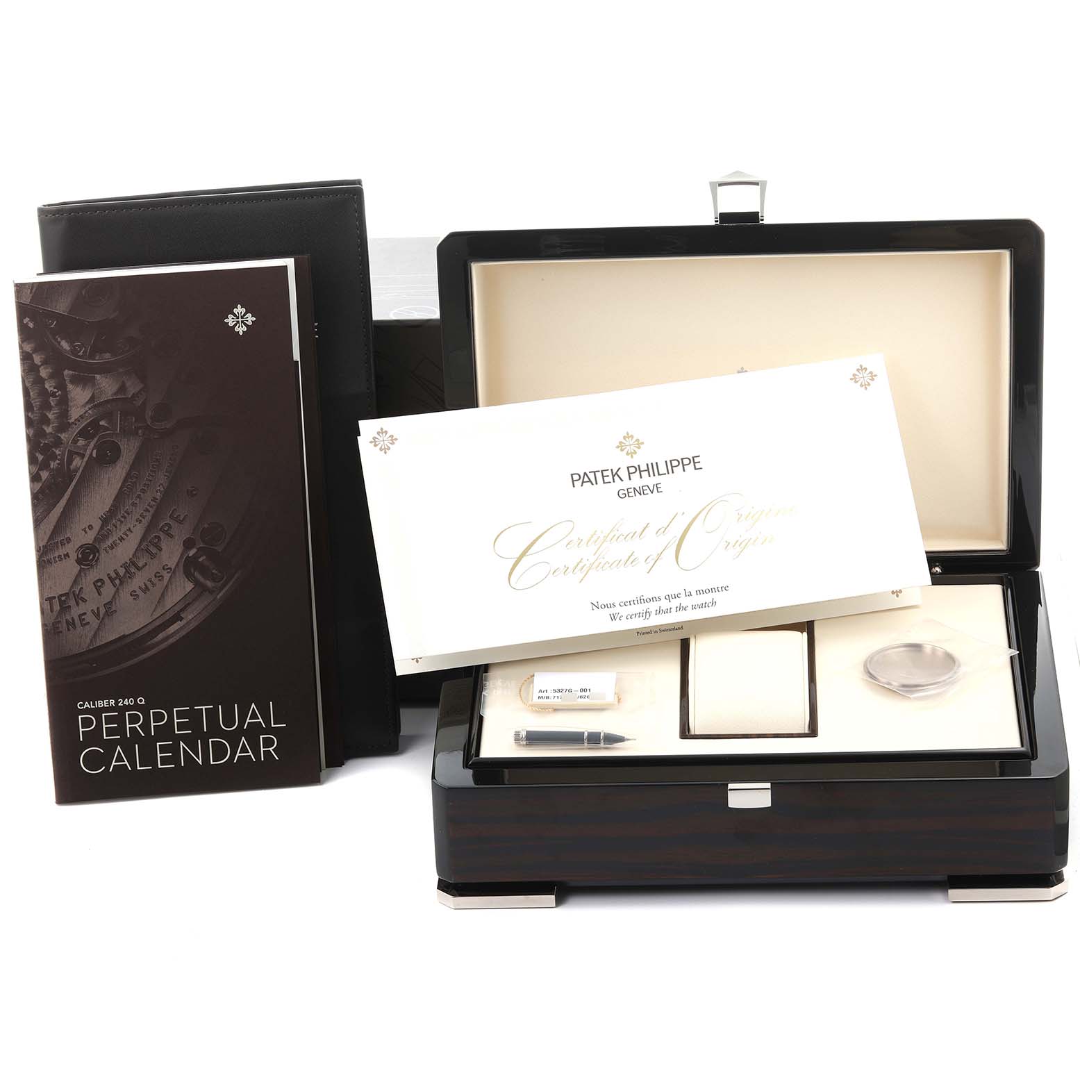 The image shows a Patek Philippe Complications 5327G-001 Men's White Gold Blue Dial 5327G-001 Men's White Gold Blue Dial watch box, certificate, manual, and accessories from a top-front angle.