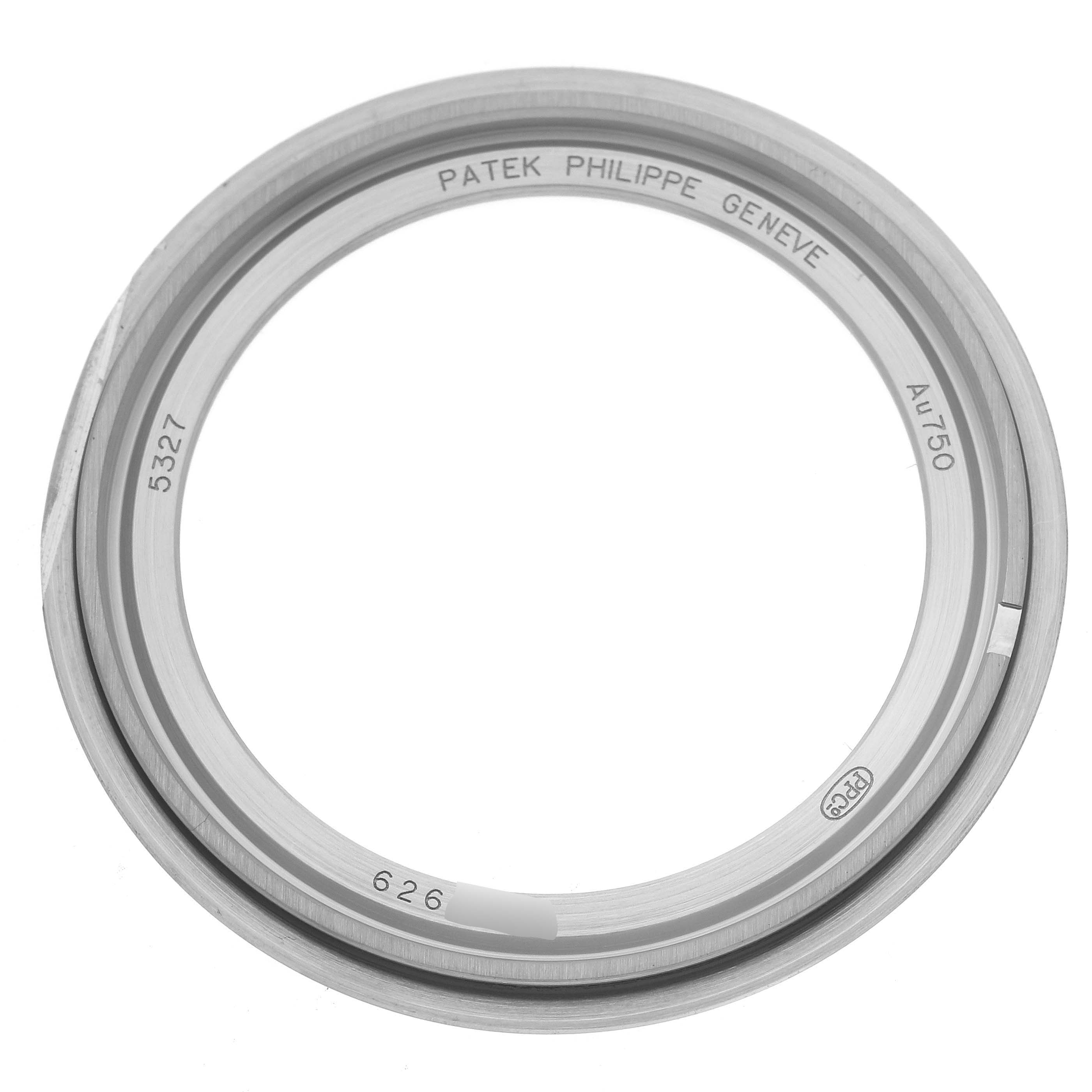 The image shows the bezel of a Patek Philippe Complications 5327G-001 Men's White Gold Blue Dial 5327G-001 Men's White Gold Blue Dial watch, viewed from a top-down angle.