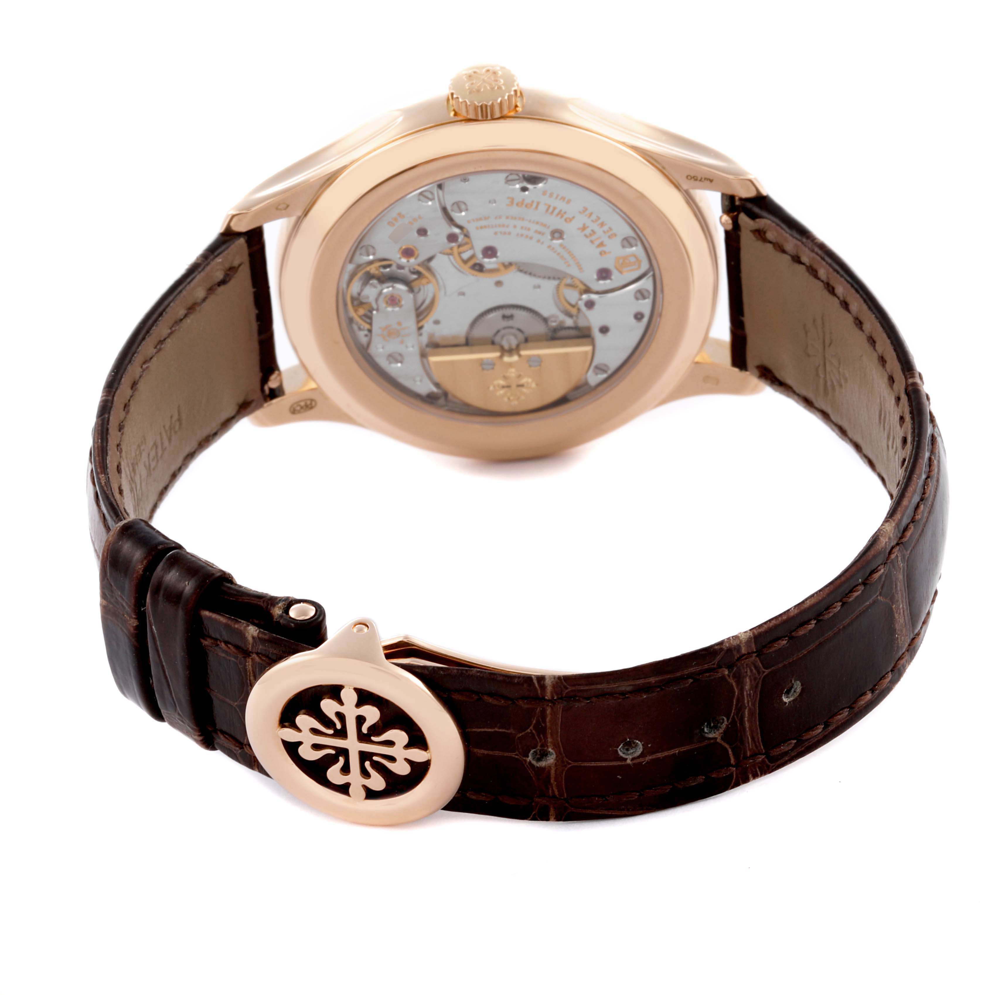 The image shows the back of the Patek Philippe Complications 5327R-001 Men's Rose Gold White Dial 5327R-001 Men's Rose Gold White Dial watch, displaying the movement and leather strap detail.