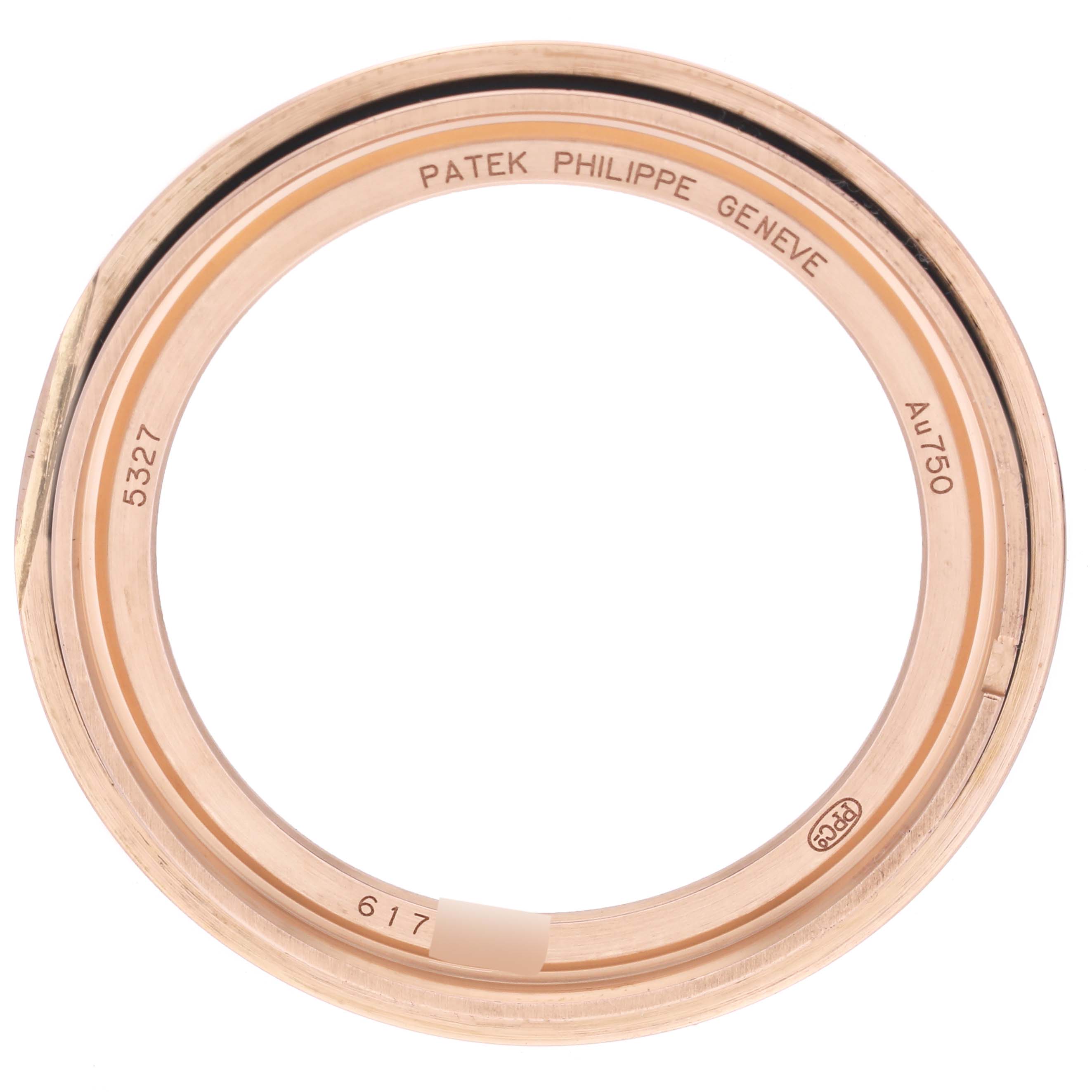 The image shows a top view of the ring bezel part of a Patek Philippe Complications 5327R-001 Men's Rose Gold White Dial 5327R-001 Men's Rose Gold White Dial watch.