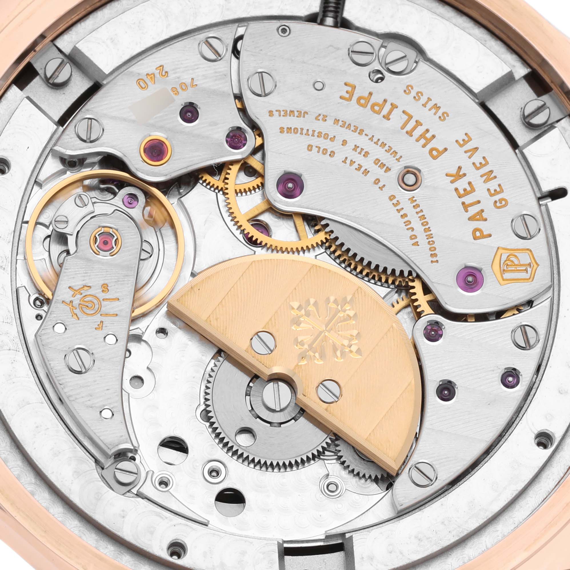 The image shows the intricate movement and inner mechanism of a Patek Philippe Complications 5327R-001 Men's Rose Gold White Dial 5327R-001 Men's Rose Gold White Dial model from the back angle.
