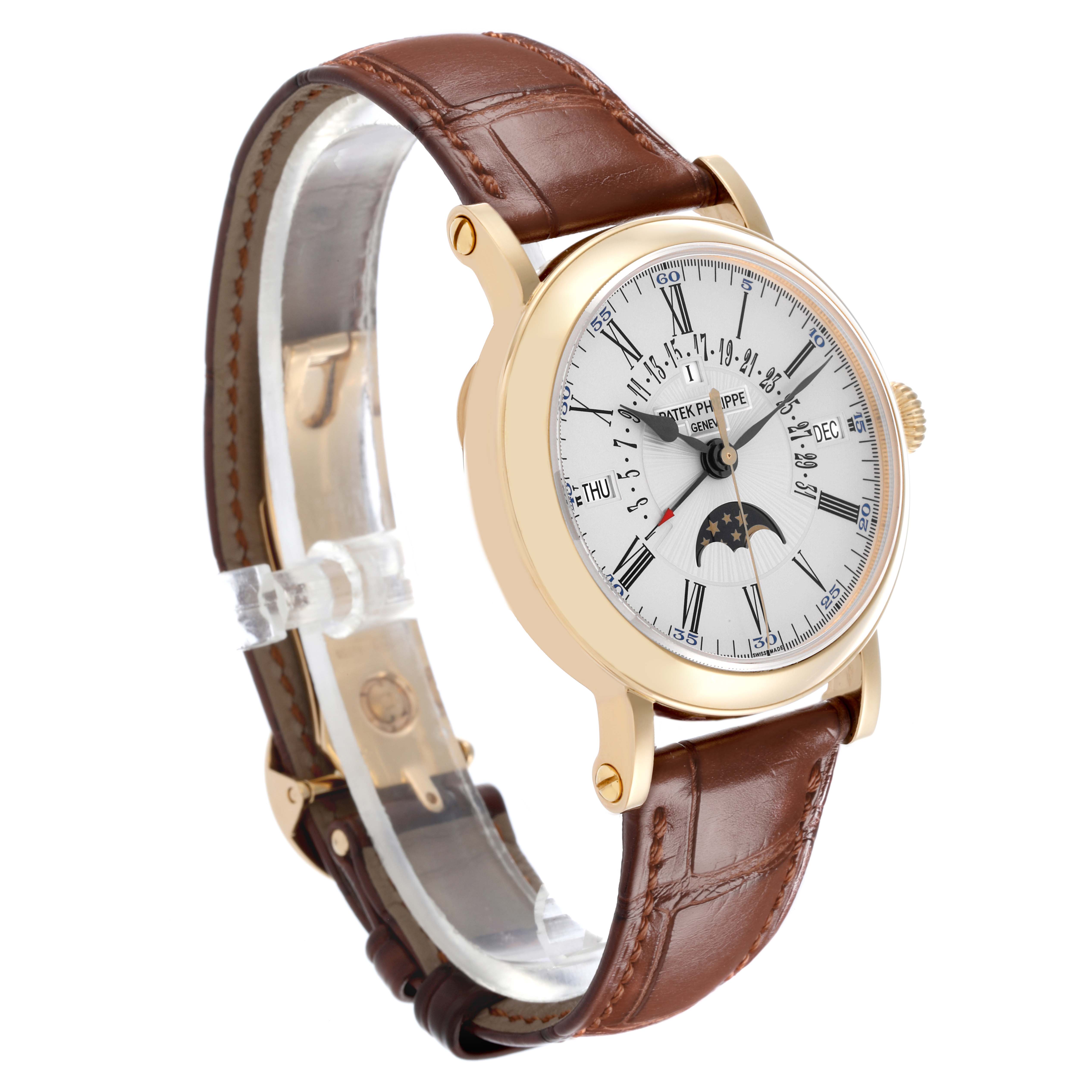 The Patek Philippe Complications 5159J Men's Yellow Gold Silver Dial 5159J Men's Yellow Gold Silver Dial watch is shown at a slight angle, displaying the dial, case, crown, and brown leather strap.