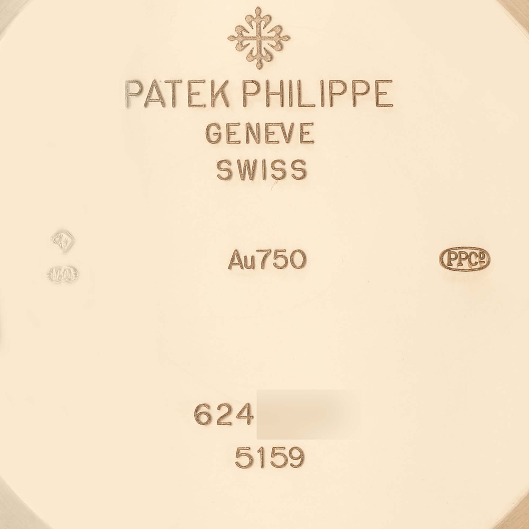 This image shows the back casing of a Patek Philippe Complications 5159J Men's Yellow Gold Silver Dial 5159J Men's Yellow Gold Silver Dial watch, highlighting the engravings and gold mark (Au750).