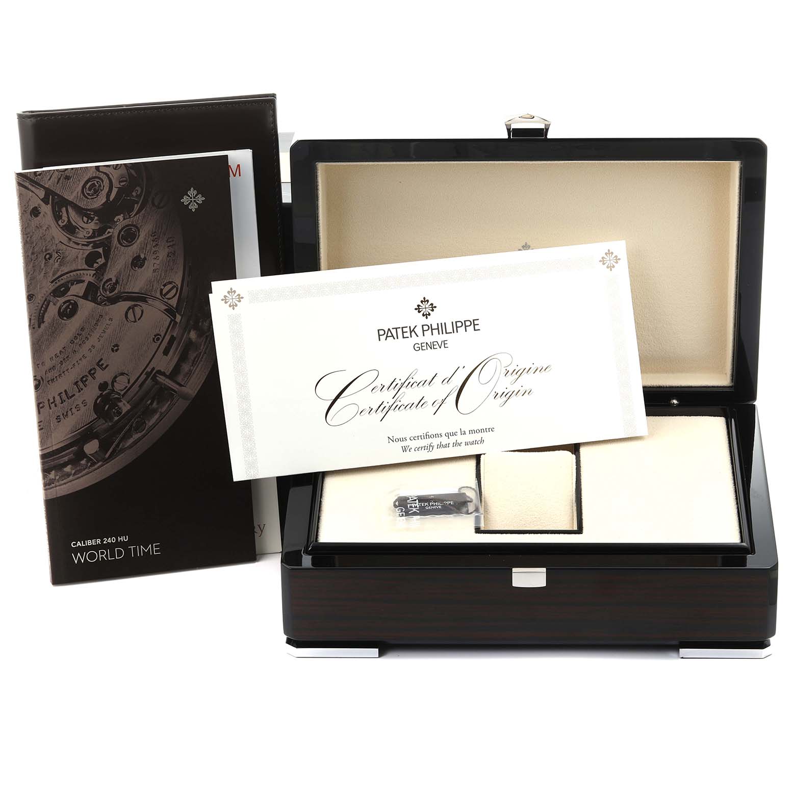 The image shows the watch box, manuals, and certificate for a Patek Philippe Complications 5231G-001 Men's White Gold Silver Dial 5231G-001 Men's White Gold Silver Dial model from a frontal angle.