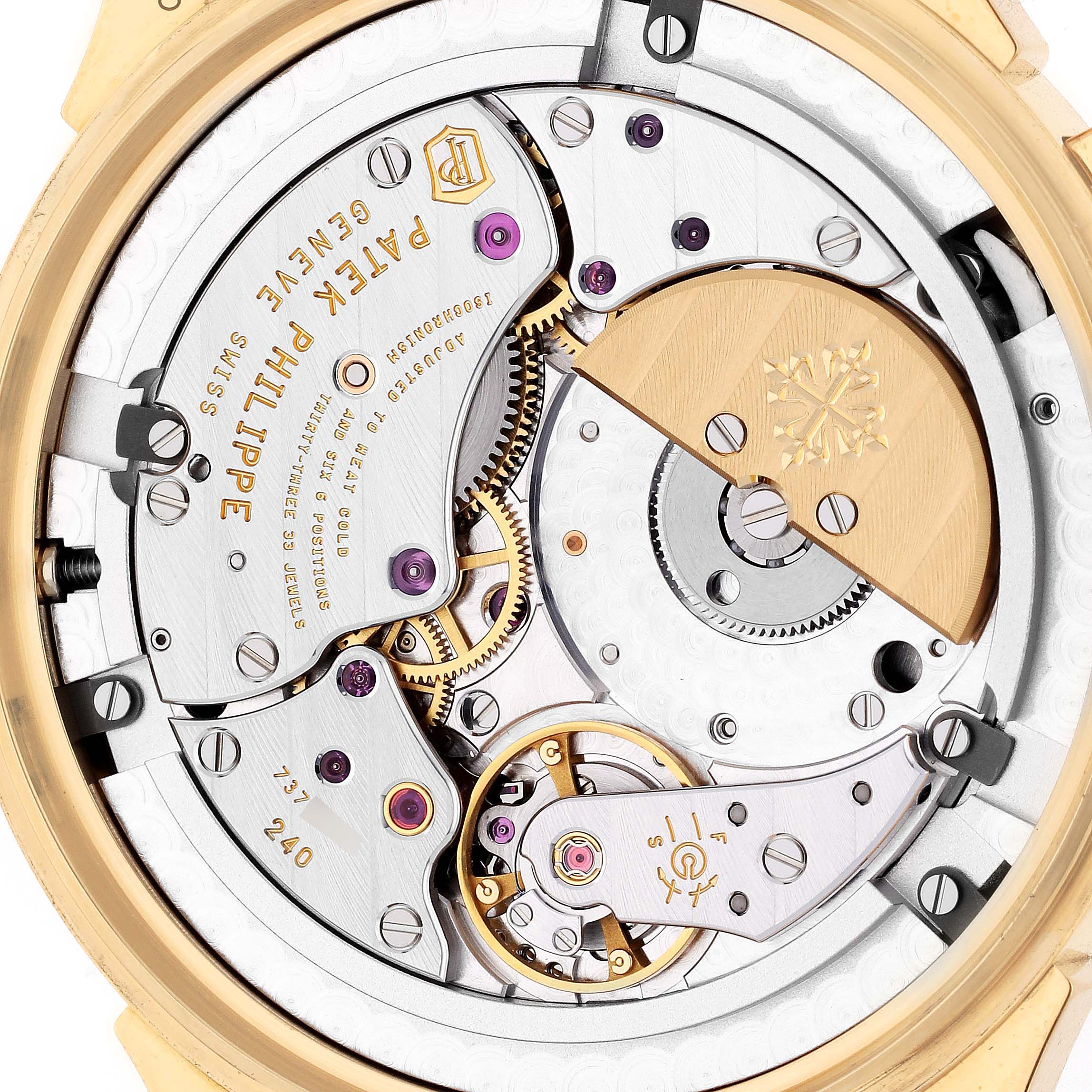 The image shows the back view of the Patek Philippe Complications 5231J-001 Men's Yellow Gold Silver Dial 5231J-001 Men's Yellow Gold Silver Dial watch, highlighting its intricate automatic movement and rotor.