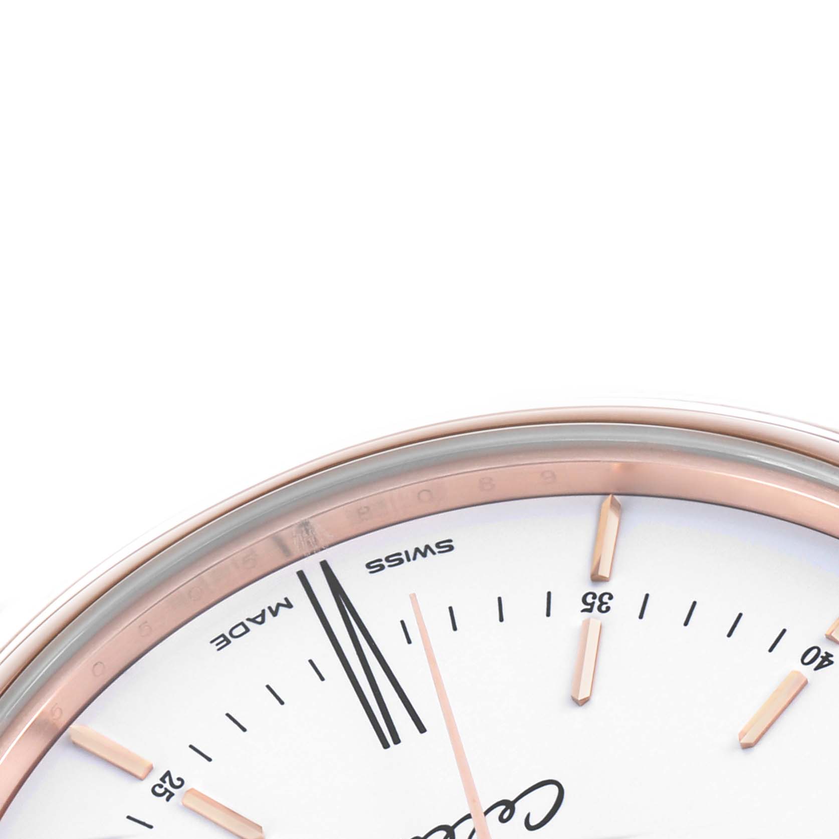 The image shows the upper part of the dial and bezel of a Rolex Cellini 50505 Men's Rose Gold White Dial watch at an oblique angle.