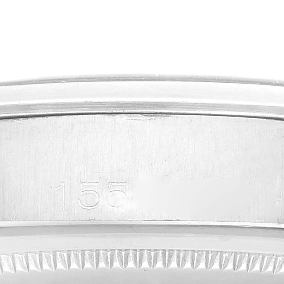 This is a close-up view of the side of a Rolex Vintage Collection 1500 Men's Stainless Steel Black Dial 1500 Men's Stainless Steel Black Dial watch, showing the model number engraving and part of the bezel.