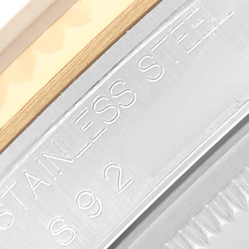 The image shows a close-up of the side of a Rolex Datejust 16233 Men's Steel and Gold (two tone) Champagne Dial 16233 Men's Steel and Gold (two tone) Champagne Dial watch, highlighting the engraving and metal finish.