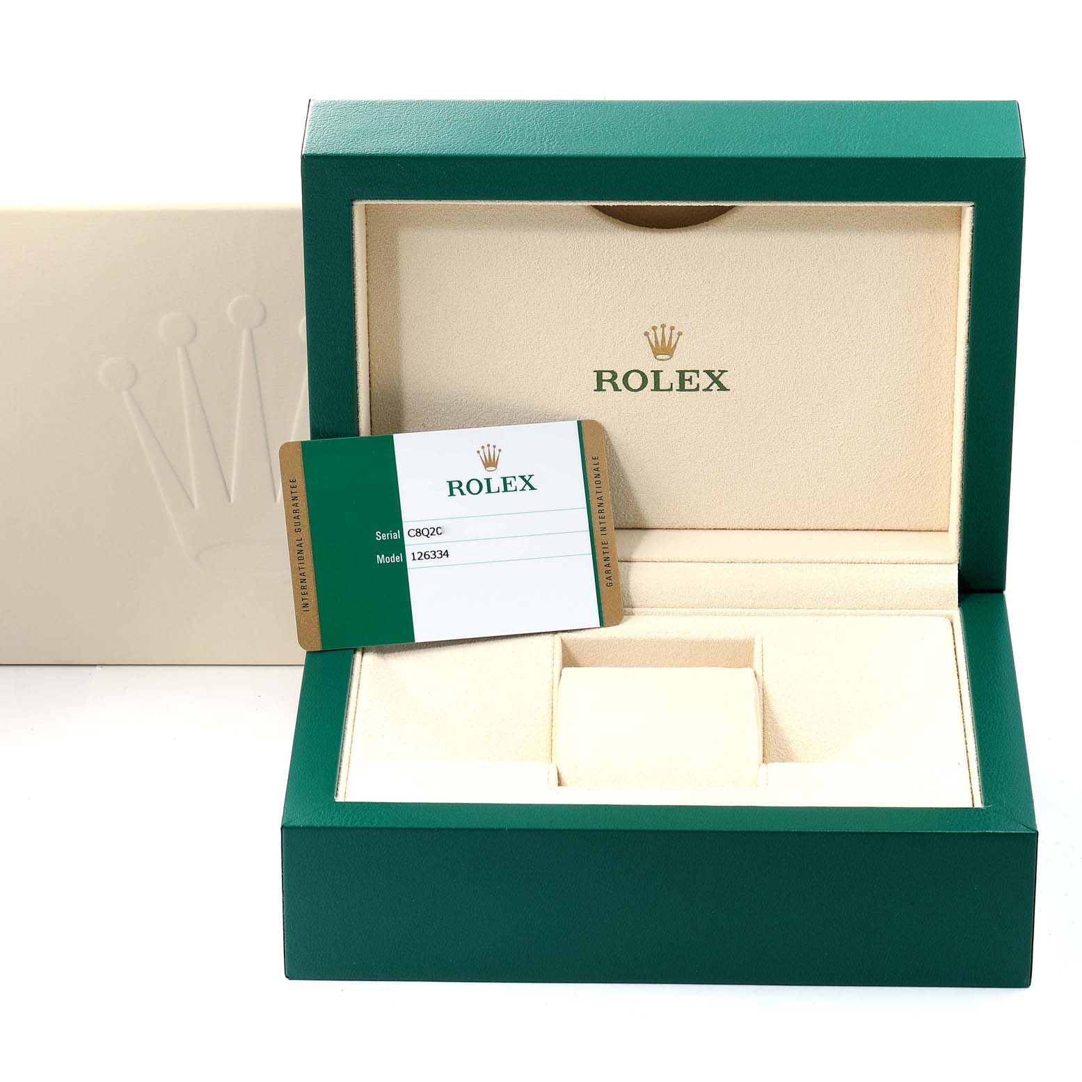This image shows the open green and cream box for the Rolex Datejust 41 126334 Men
s Stainless Steel Black Dial 126334 Men
s Stainless Steel Black Dial with an accompanying Best Quality
ity card.