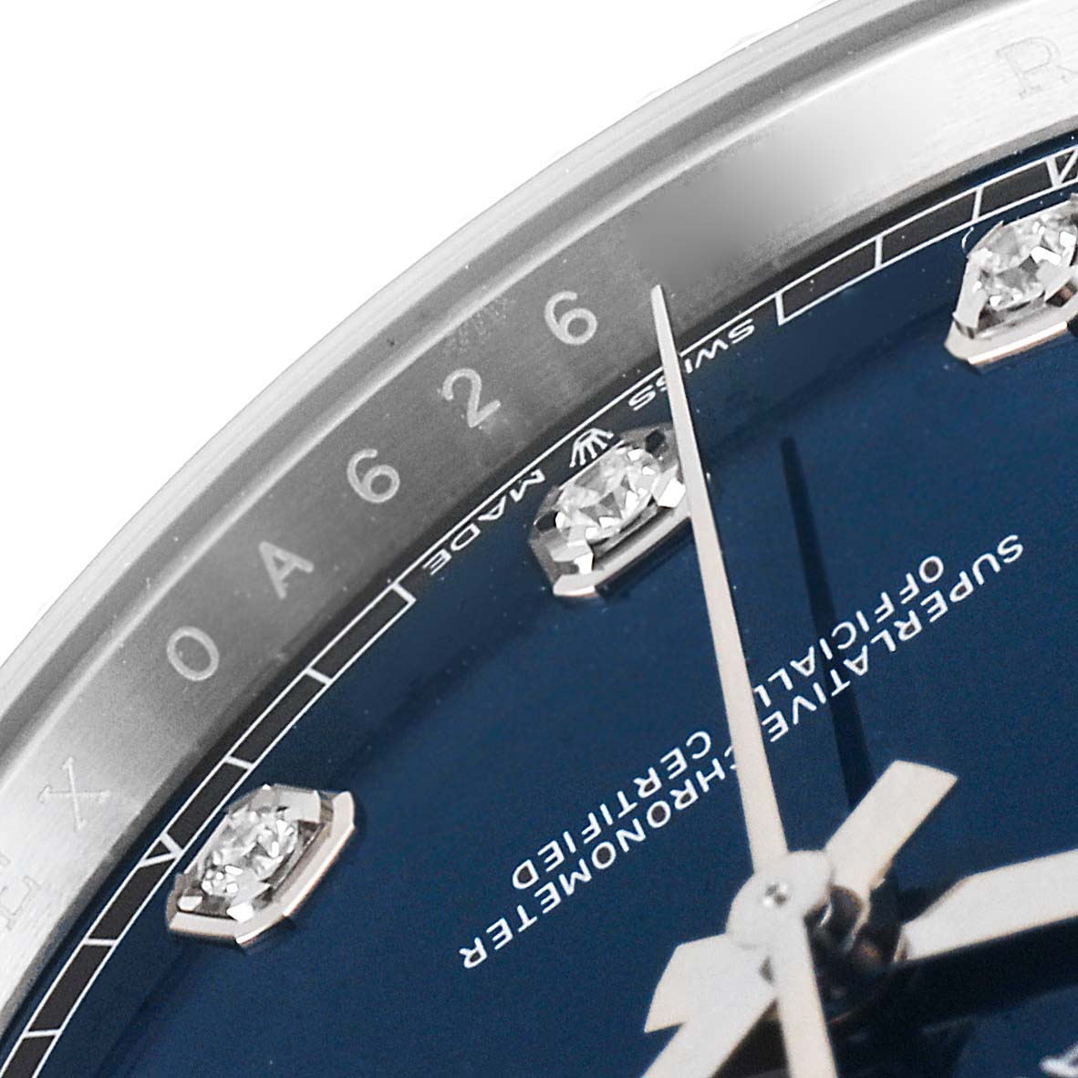 The image shows a close-up of the dial of the Rolex Datejust 41 126334 Men's Stainless Steel Blue Dial 126334 Men's Stainless Steel Blue Dial with a blue face, including diamond markers, hands, and part of the bezel.