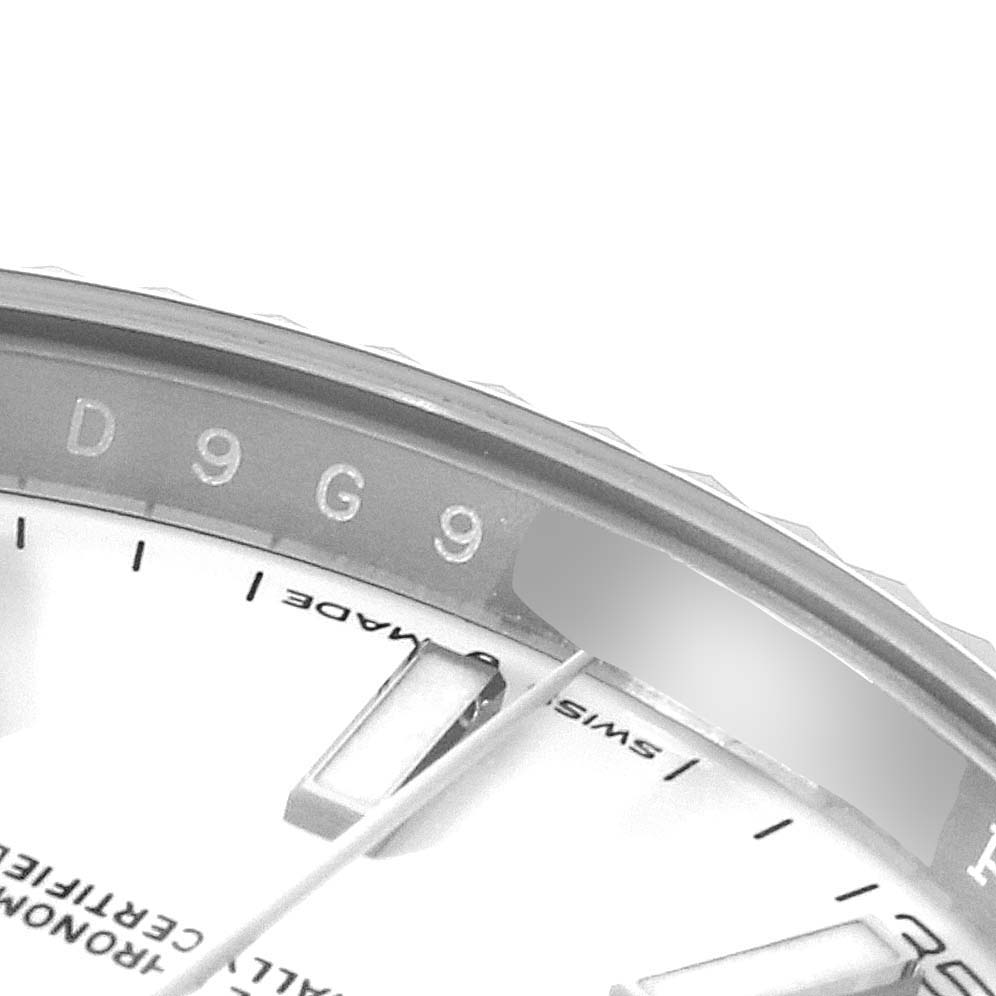This image shows a close-up, partial view of the dial and serial number of a Rolex Datejust 41 126334 Men
s Stainless Steel White Dial 126334 Men
s Stainless Steel White Dial.