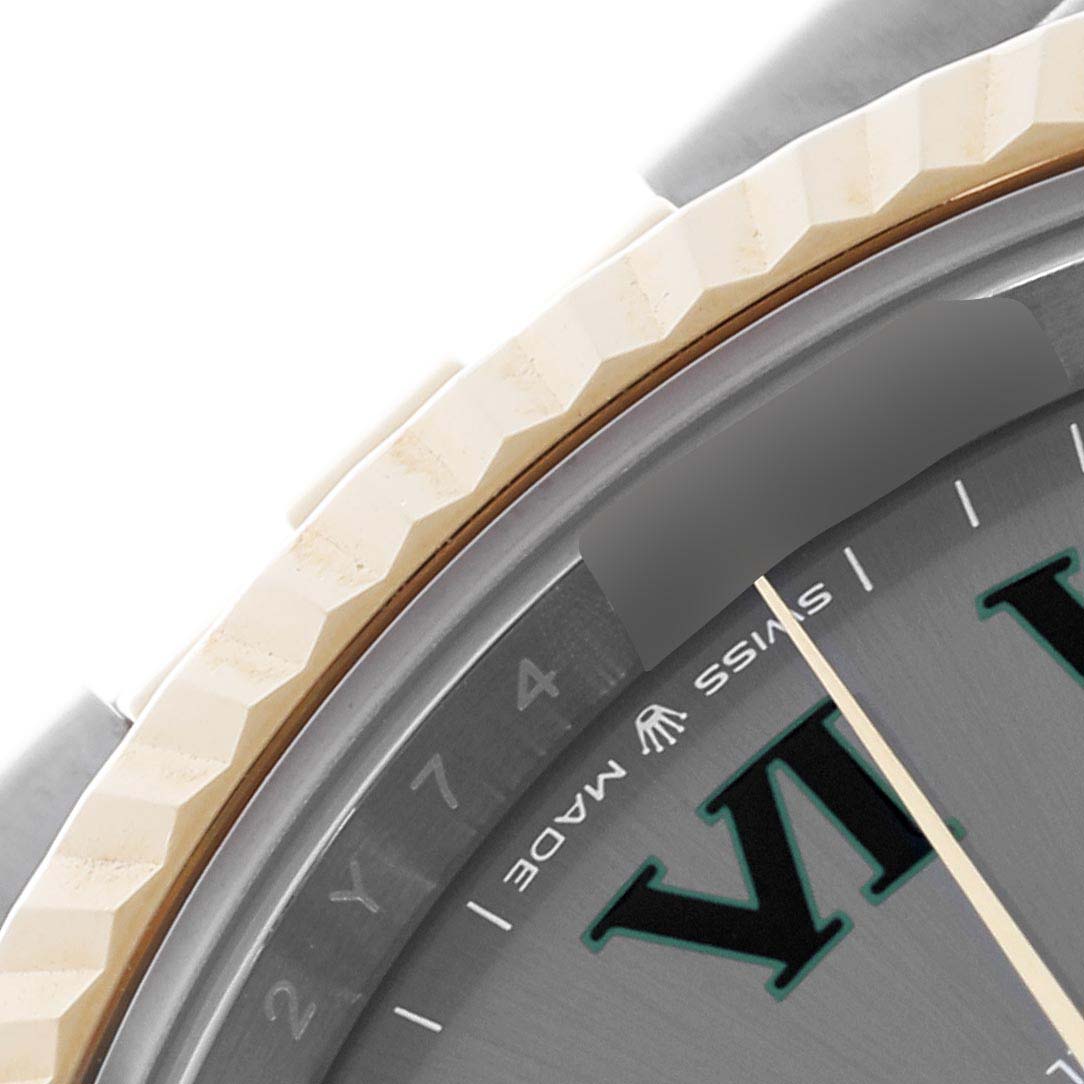 This close-up of the Rolex Datejust 41 126333 Men's Steel and Gold (two tone) Grey Dial 126333 Men's Steel and Gold (two tone) Grey Dial shows the bezel, part of the dial, and Roman numeral hour markers.