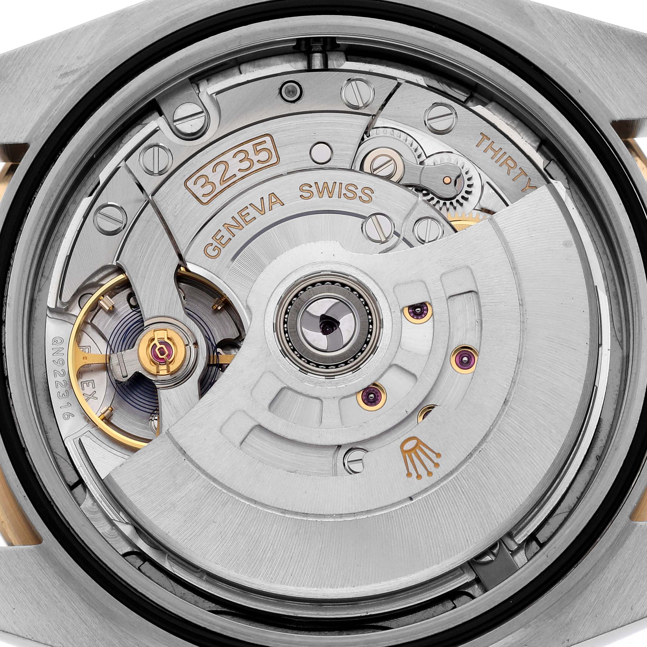 The image shows the movement mechanism of a Rolex Datejust 41 126333 Men's Steel and Gold (two tone) Grey Dial 126333 Men's Steel and Gold (two tone) Grey Dial, showcasing its intricate inner components.