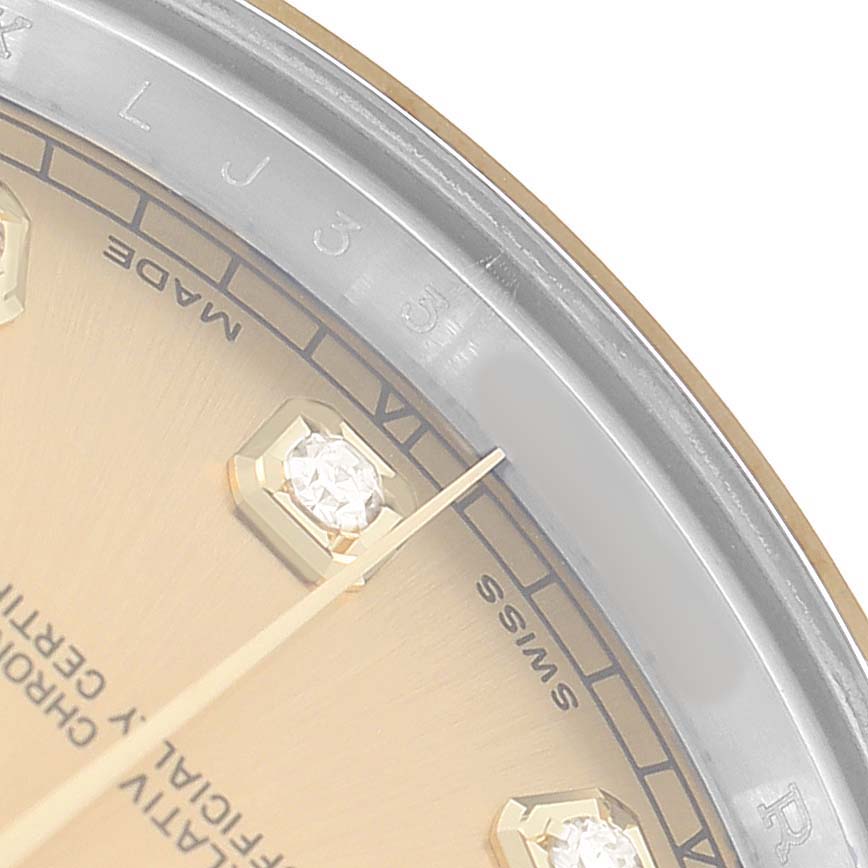The image shows a partial close-up of a Rolex Datejust 41 116333 Men's Steel and Gold (two tone) Champagne Dial watch dial, highlighting the hour markers and a portion of the bezel.