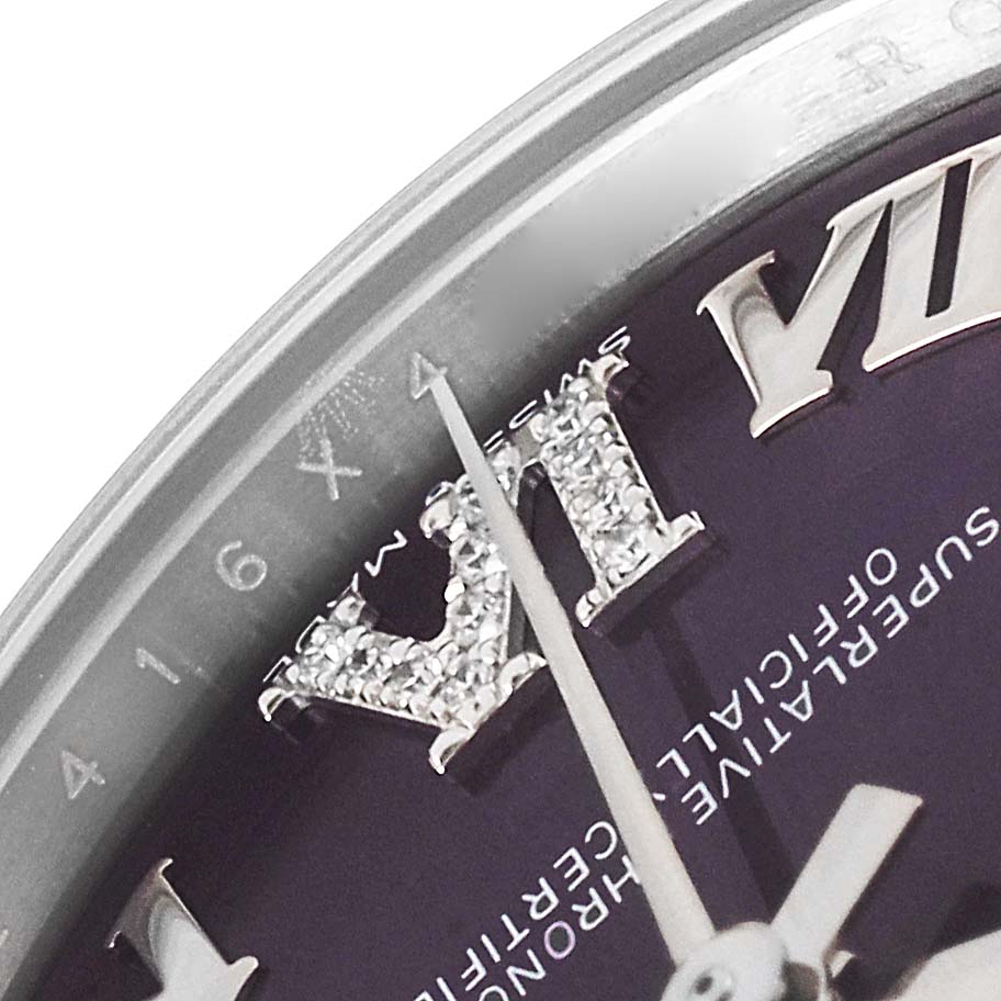 This close-up image of a Rolex Mid-Size 278274 Women
s Stainless Steel Blue Dial 278274 Women
s Stainless Steel Blue Dial model shows the watch face, including the Roman numeral VII, the minute hand, and part of the second hand.