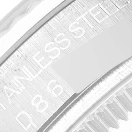 The image shows a close-up of the side engraving on a stainless steel bezel of a Rolex Mid-Size 178274 Women
s Stainless Steel White Dial 178274 Women
s Stainless Steel White Dial watch.