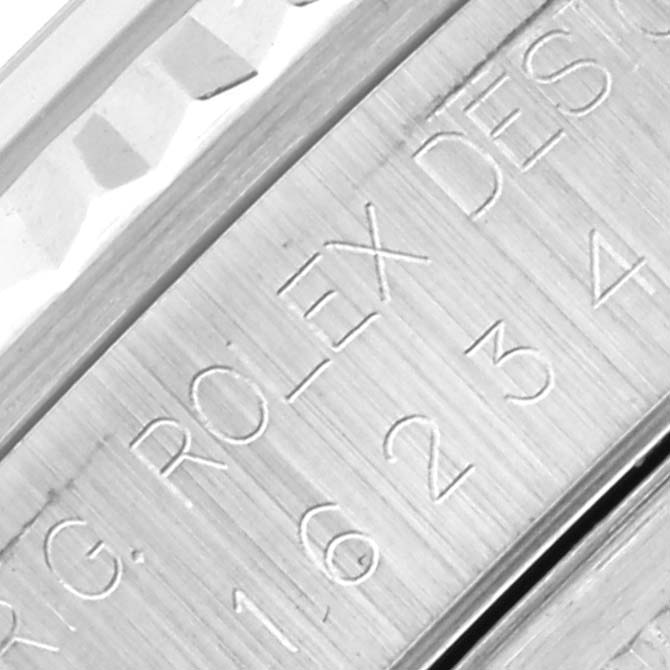 This is a close-up angle showing the engravings on the inner bezel of a Rolex Datejust 16234 Men's Stainless Steel White Dial 16234 Men's Stainless Steel White Dial watch.