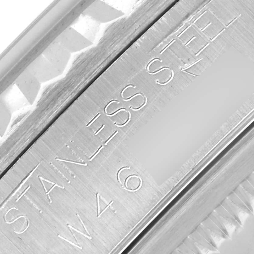 The image shows the side engraving of a Rolex Datejust 16234 Men's Stainless Steel White Dial 16234 Men's Stainless Steel White Dial, displaying "Stainless Steel" text.