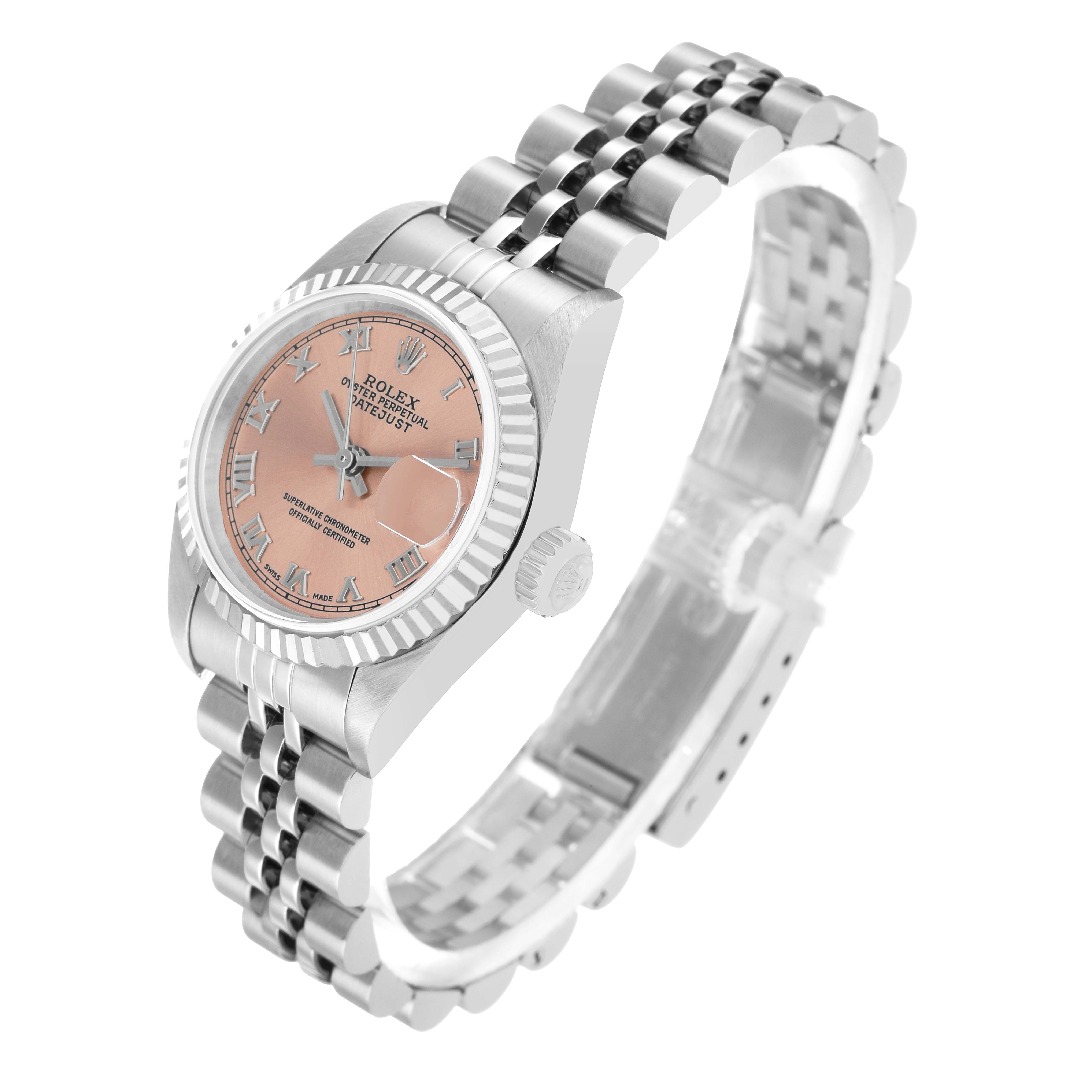 The Rolex Datejust 79174 Women's Stainless Steel Pink Dial watch is shown at a three-quarter angle, revealing the dial, bezel, crown, and Jubilee bracelet.
