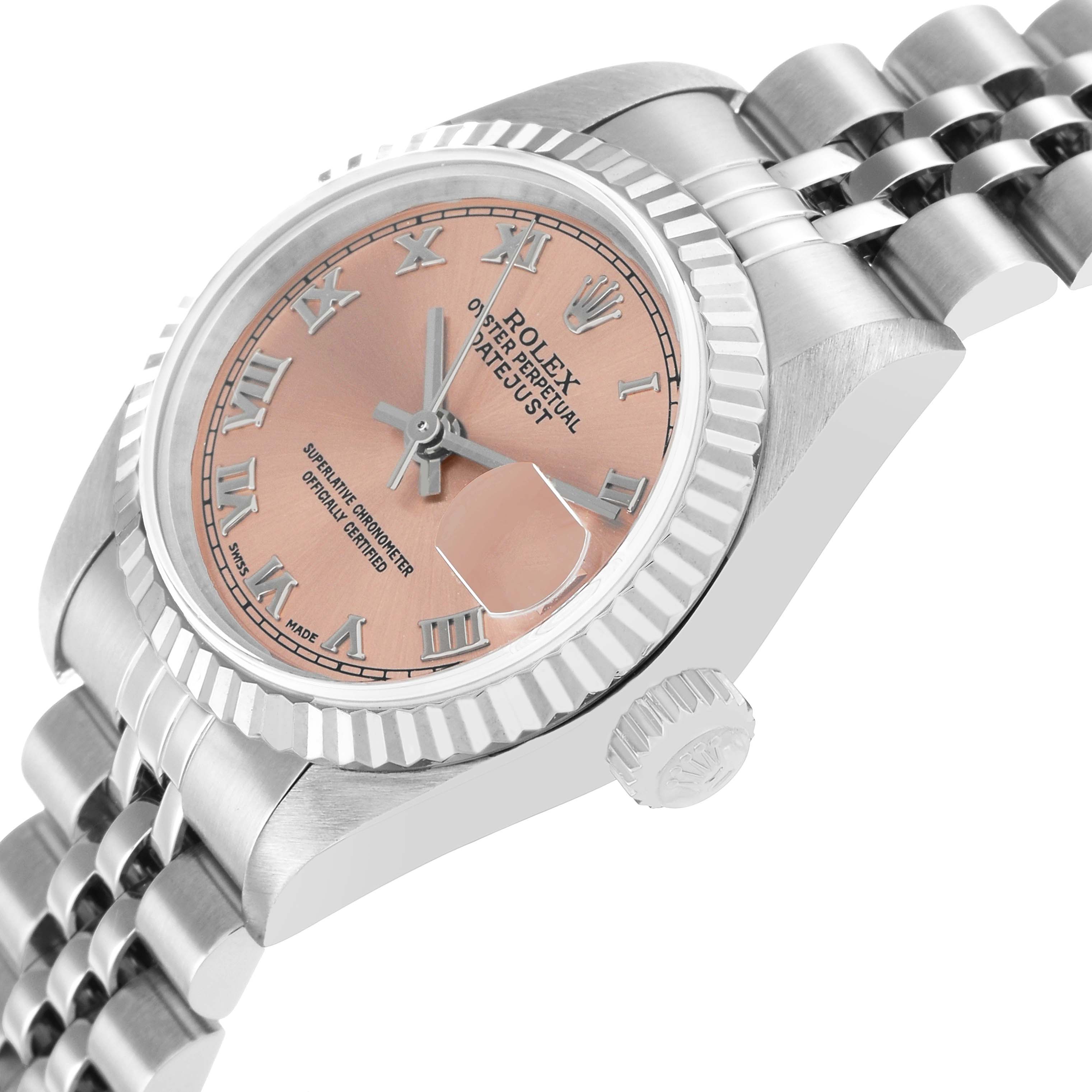 The Rolex Datejust 79174 Women's Stainless Steel Pink Dial watch is shown from a side angle highlighting the case, crown, bracelet, and partially the dial with Roman numerals.