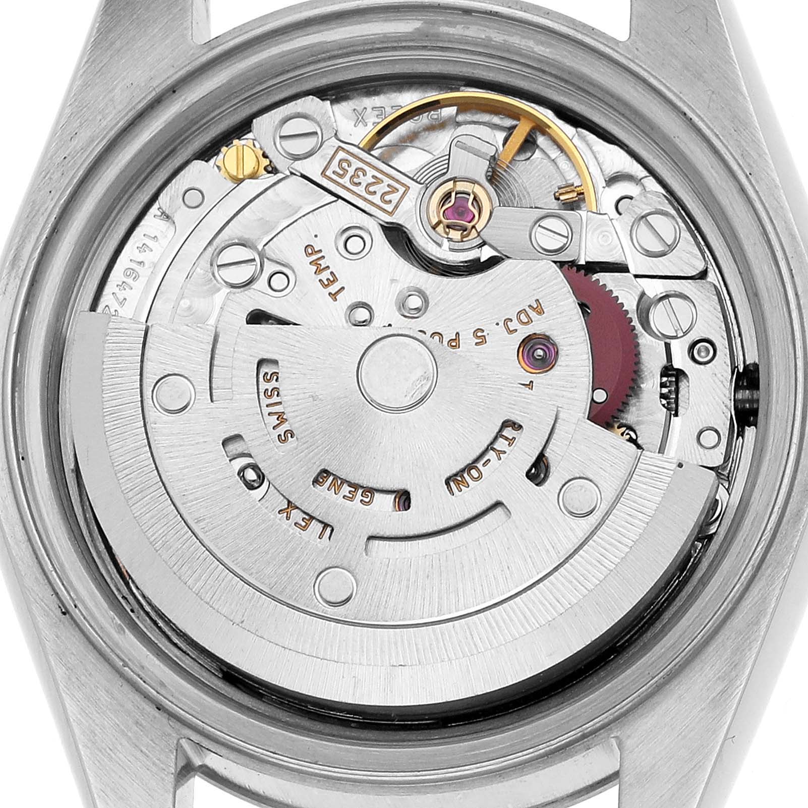 The image shows the movement of a Rolex Datejust 79174 Women's Stainless Steel Pink Dial, viewed from the back, highlighting the rotor and intricate components.