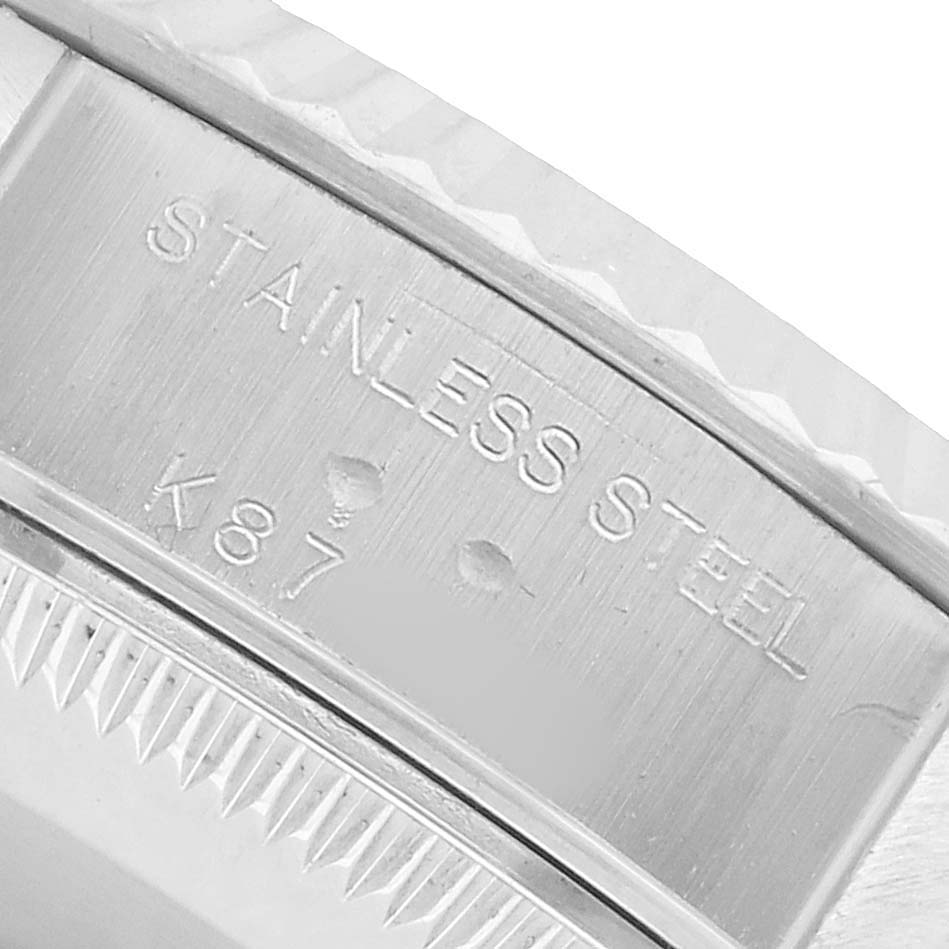 The image shows a close-up of the Rolex Datejust 79174 Women's Stainless Steel Pink Dial watch case back, highlighting "STAINLESS STEEL" engraving.