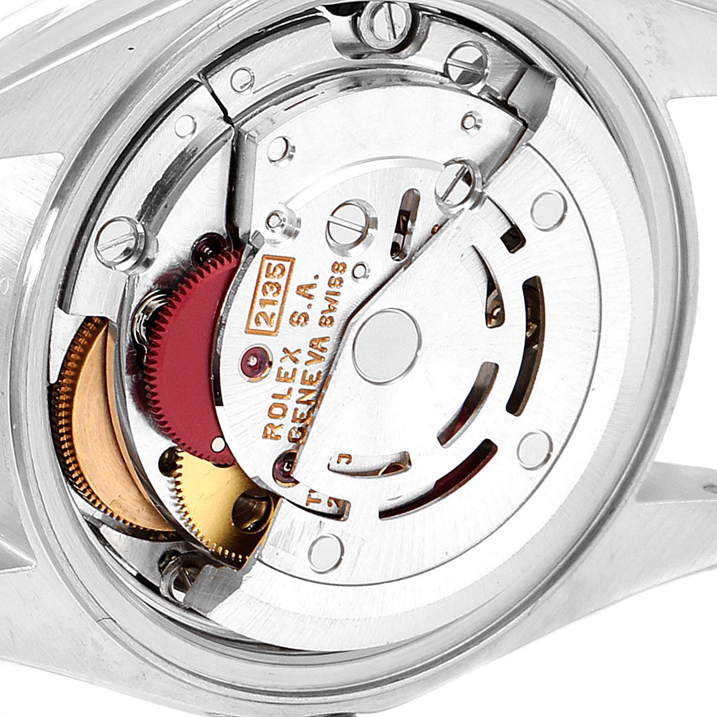 The image shows the inner mechanism and movement of a Rolex Datejust 79173 Women
s Steel and Gold (two tone) Champagne Dial 79173 Women
s Steel and Gold (two tone) Champagne Dial watch from a close-up angle.