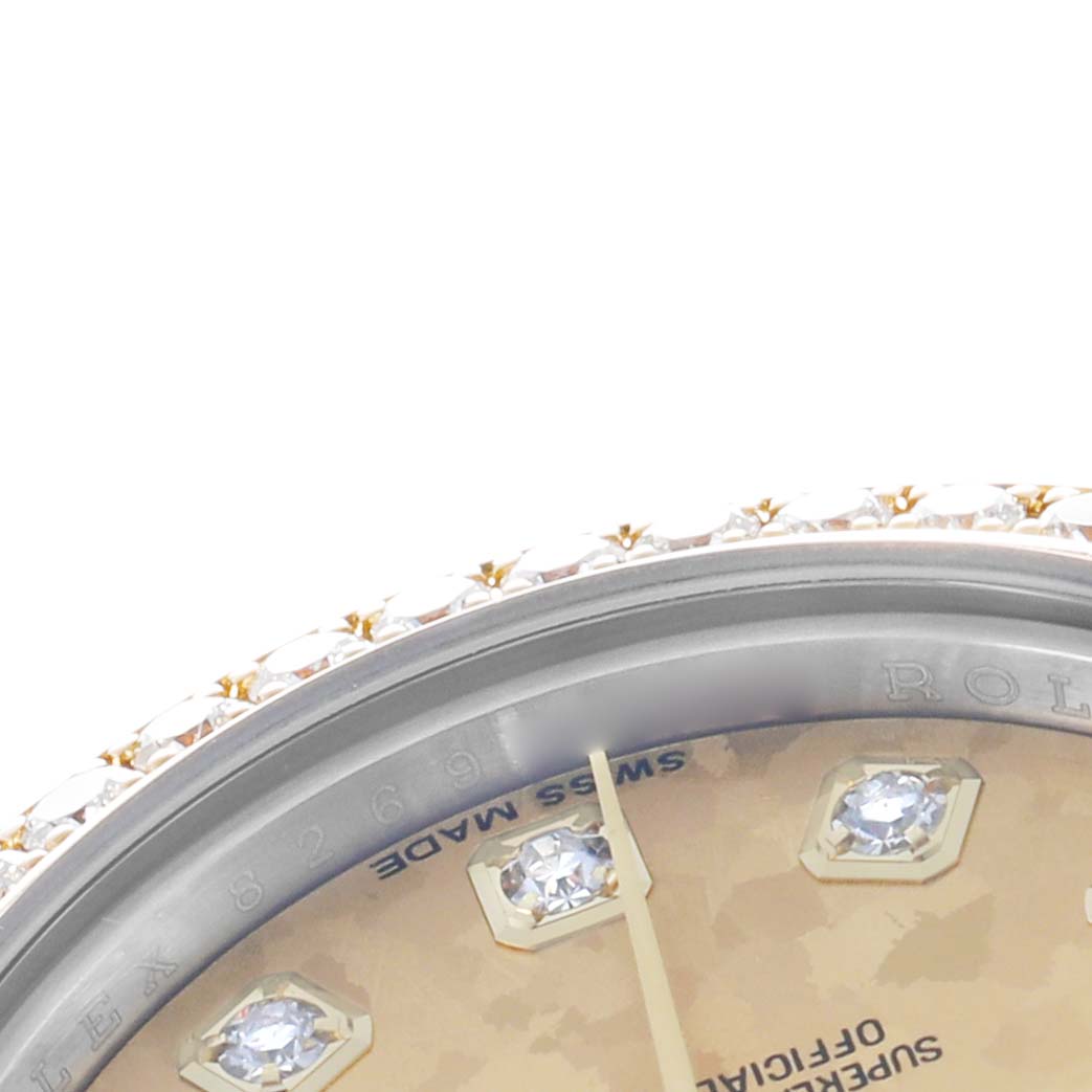 The image shows a close-up of a Rolex Datejust 179383 Women's Stainless Steel Champagne Dial watch's dial with diamond markers and part of the bezel.
