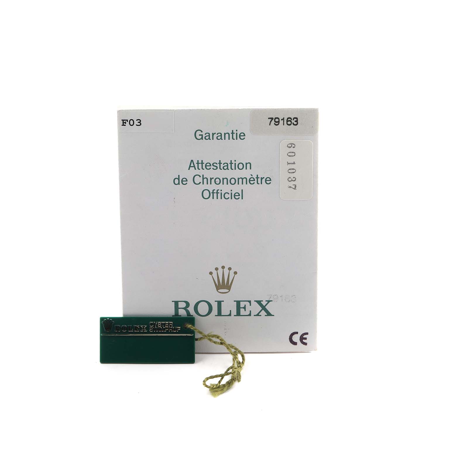 The image shows the guarantee card and a green tag for a Rolex Datejust 79163 Women's Steel and Gold (two tone) Beige Dial with model number 79163.