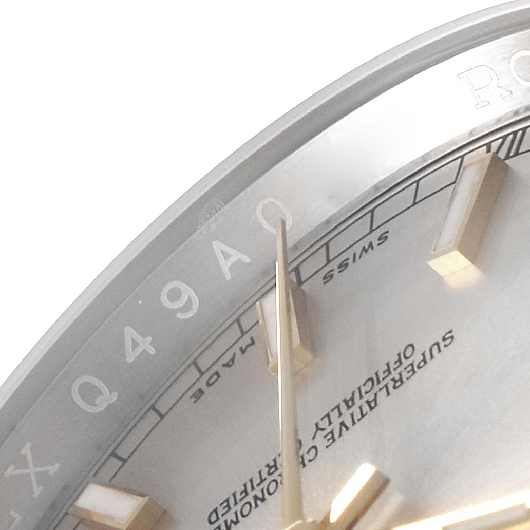This image shows a close-up view of the dial and partial bezel of a Rolex Datejust 116233 Men's Steel and Gold (two tone) Silver Dial 116233 Men's Steel and Gold (two tone) Silver Dial watch.