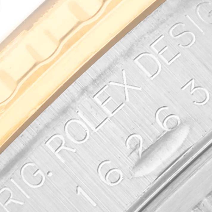 The image shows a close-up of the engraved case side of a Rolex Turn-o-Graph 16263 Men's Steel and Gold (two tone) Champagne Dial 16263 Men's Steel and Gold (two tone) Champagne Dial watch, highlighting the edge of its bezel.