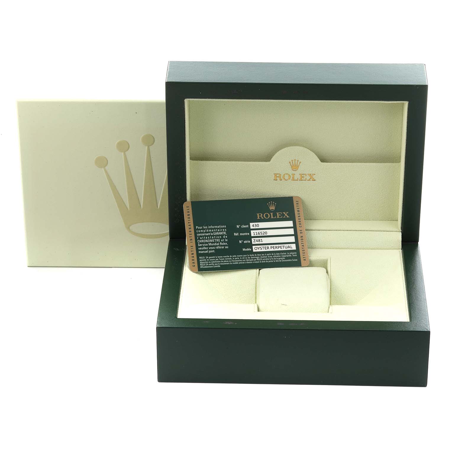 The image shows the Rolex Daytona 116520 Men
s Stainless Steel Black Dial 116520 Men
s Stainless Steel Black Dial watch box, open, with a card inside, viewed from the front.